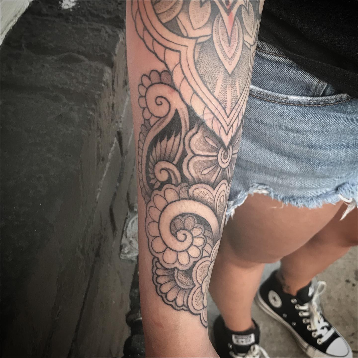 Floral pattern ornamental tattoo on the forearm by Sean Hollinger