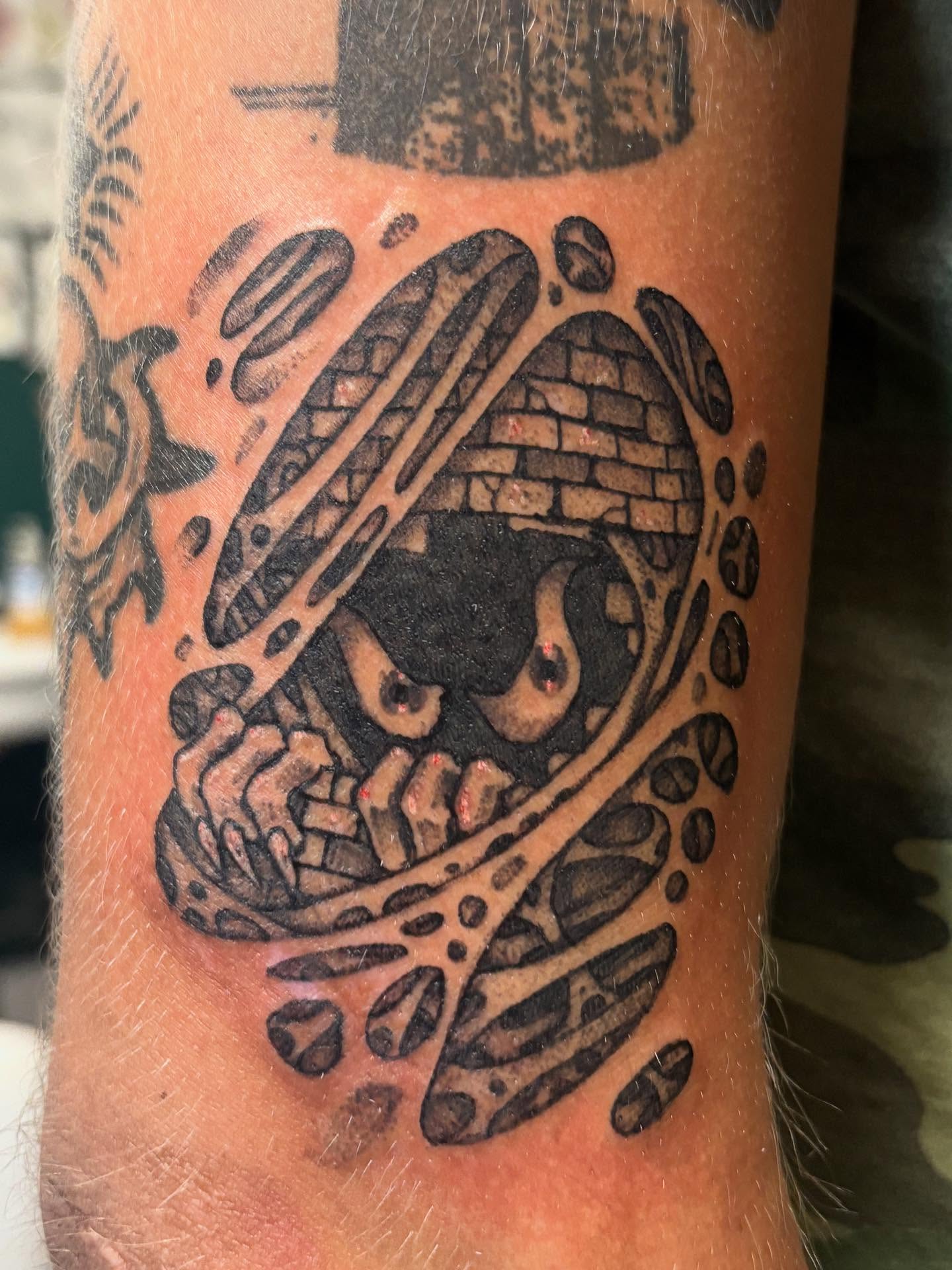 Skull with mechanical elements neo-traditional tattoo on the forearm by Brendan Smith