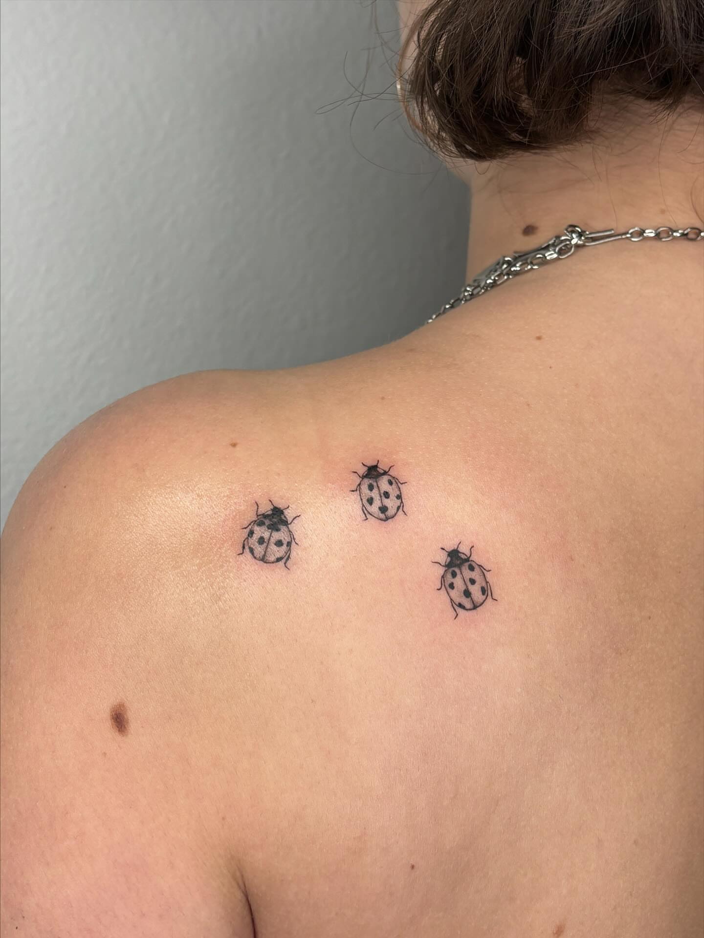 Ladybugs dotwork tattoo on the shoulder by alyssa doing tattoos