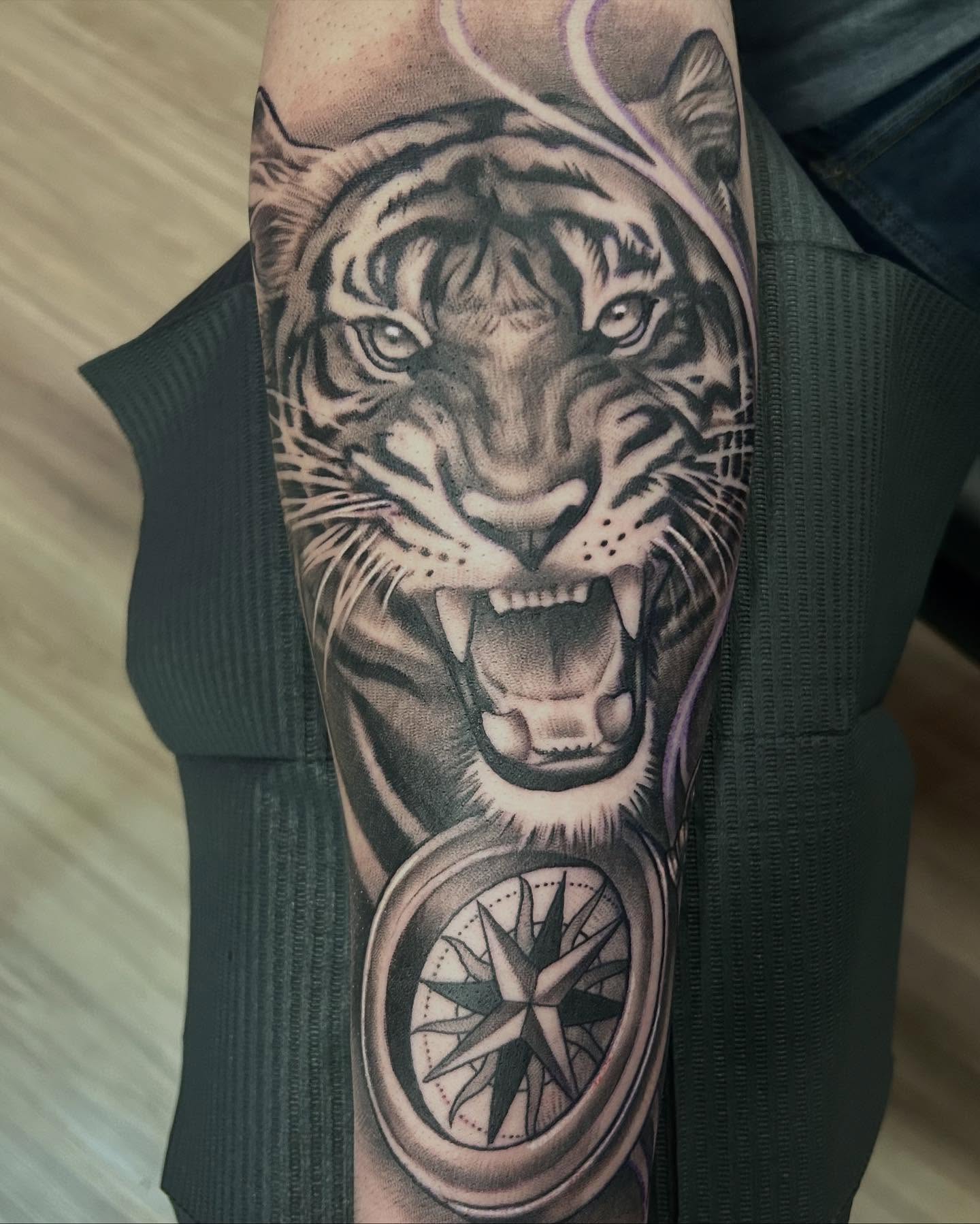 Tiger realism tattoo on the forearm by Whitney Harbin