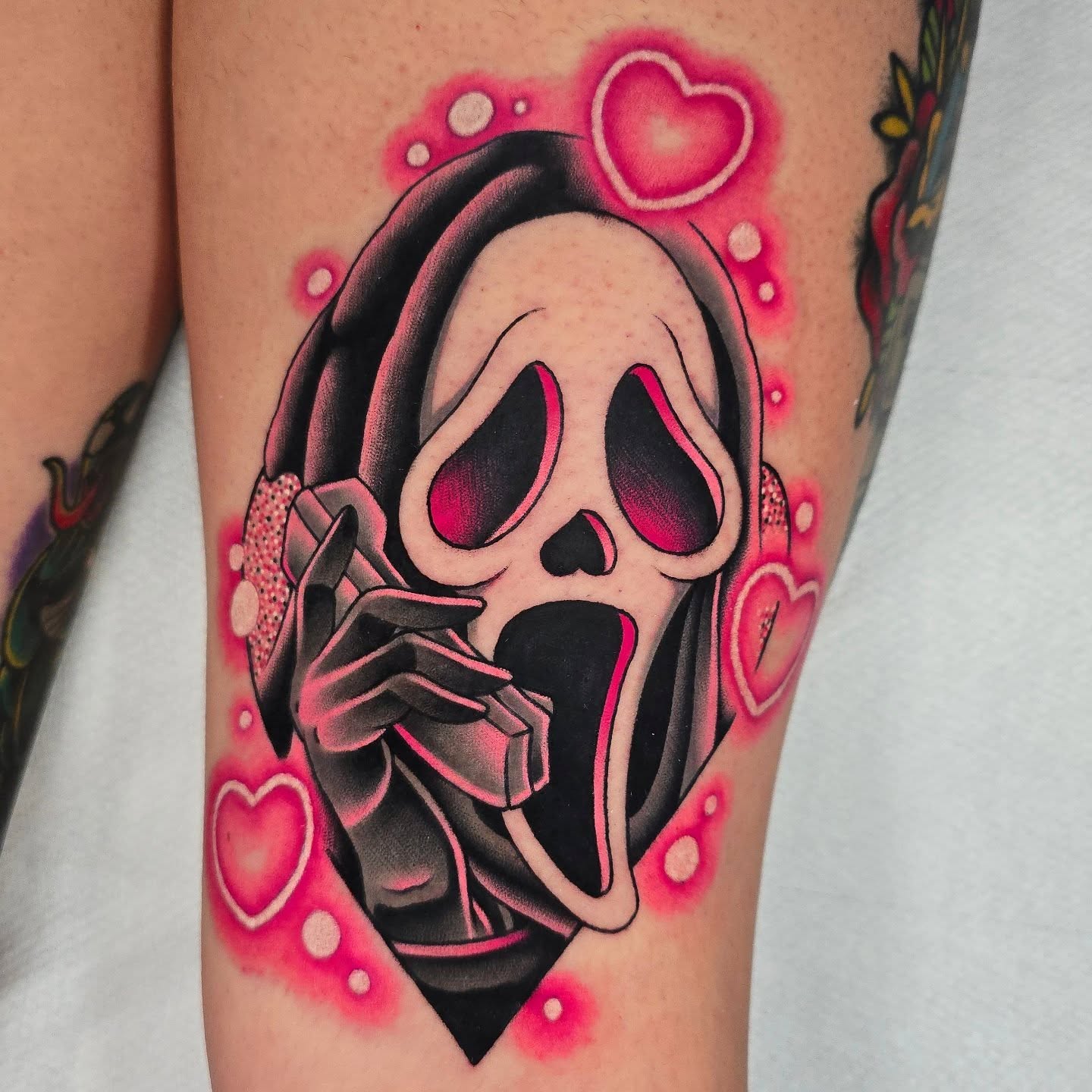 Scream mask American traditional tattoo on the leg by Justin Eldridge