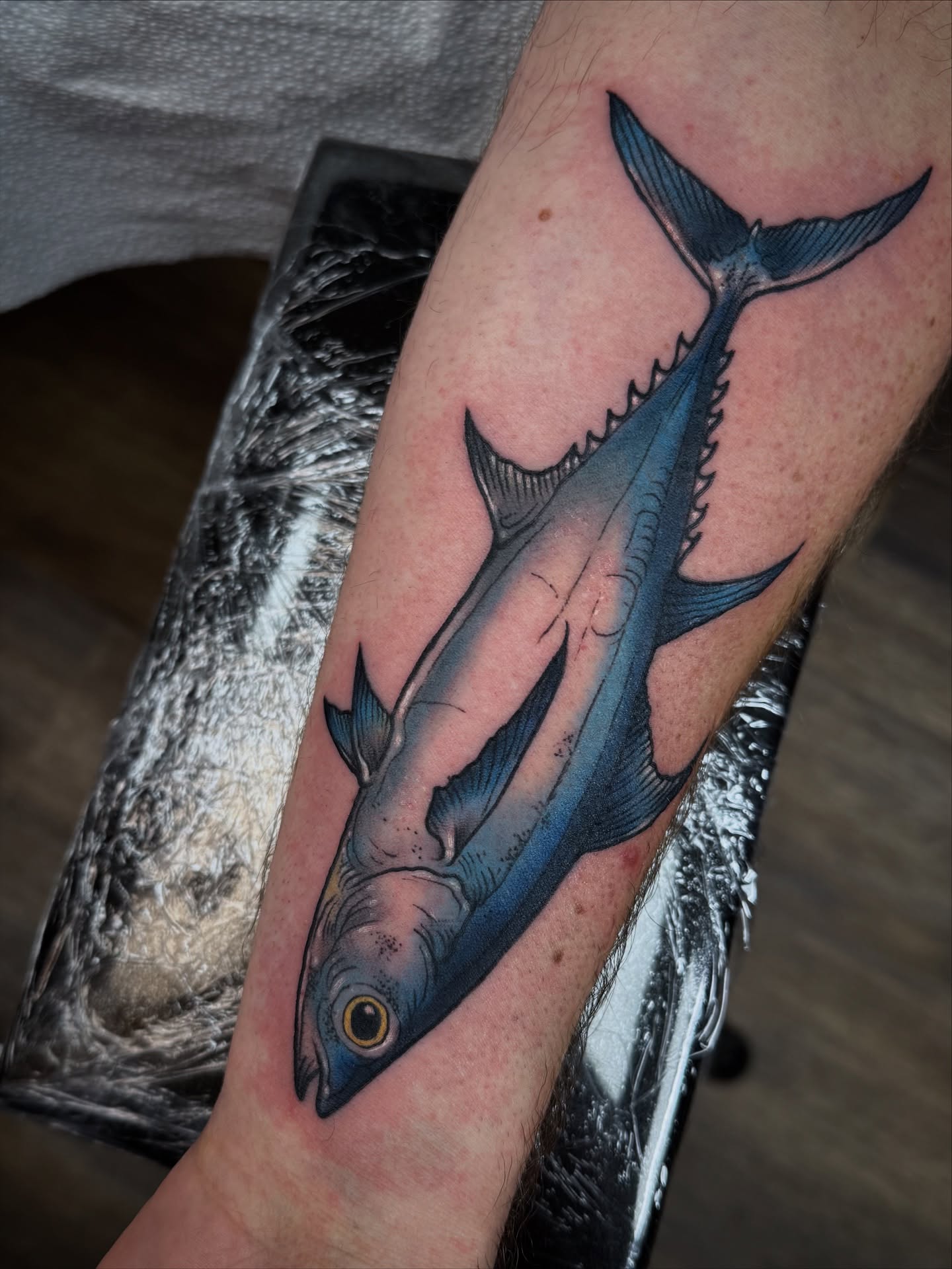 Tuna realism tattoo on the forearm by Michael Langdale