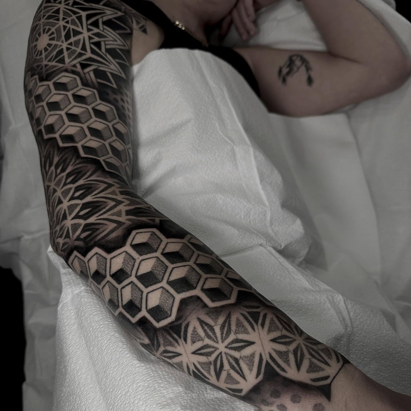 Geometric patterns geometric tattoo on the forearm by Kevin Johnson