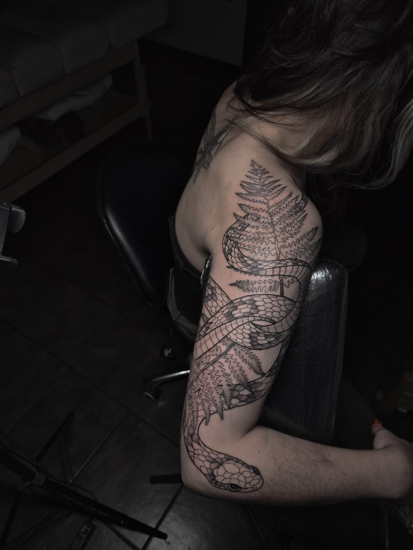 Snake and fern realism tattoo on the upper arm by Gabrielle Esperanza ☽。⋆