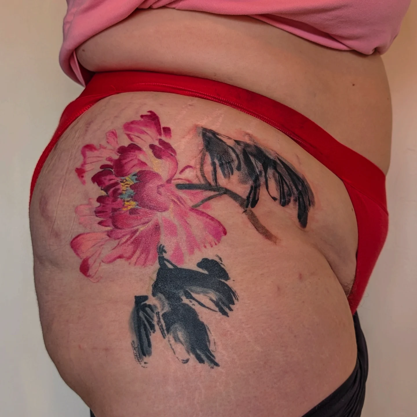 Peony flower watercolor tattoo on the thigh by Jhenn