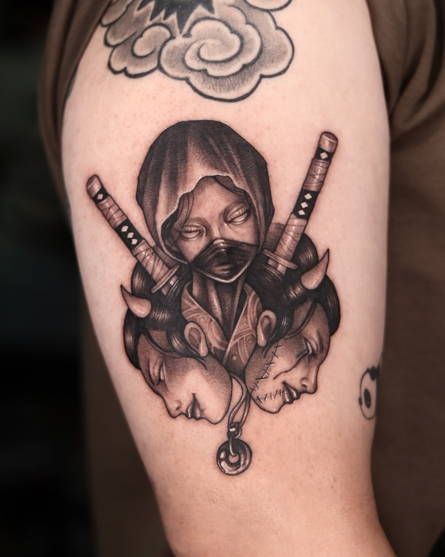 Three heads realism tattoo on the forearm by Blackwork A P S O