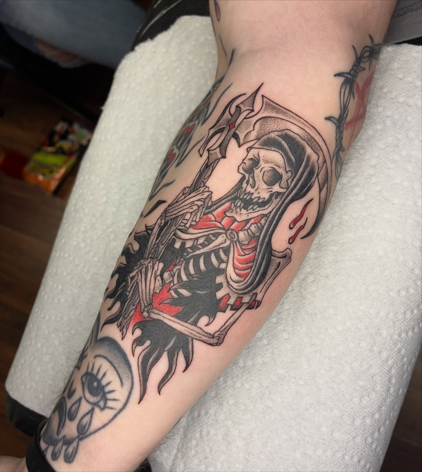 Skeleton with axe American traditional tattoo on the forearm by Lance 🦈