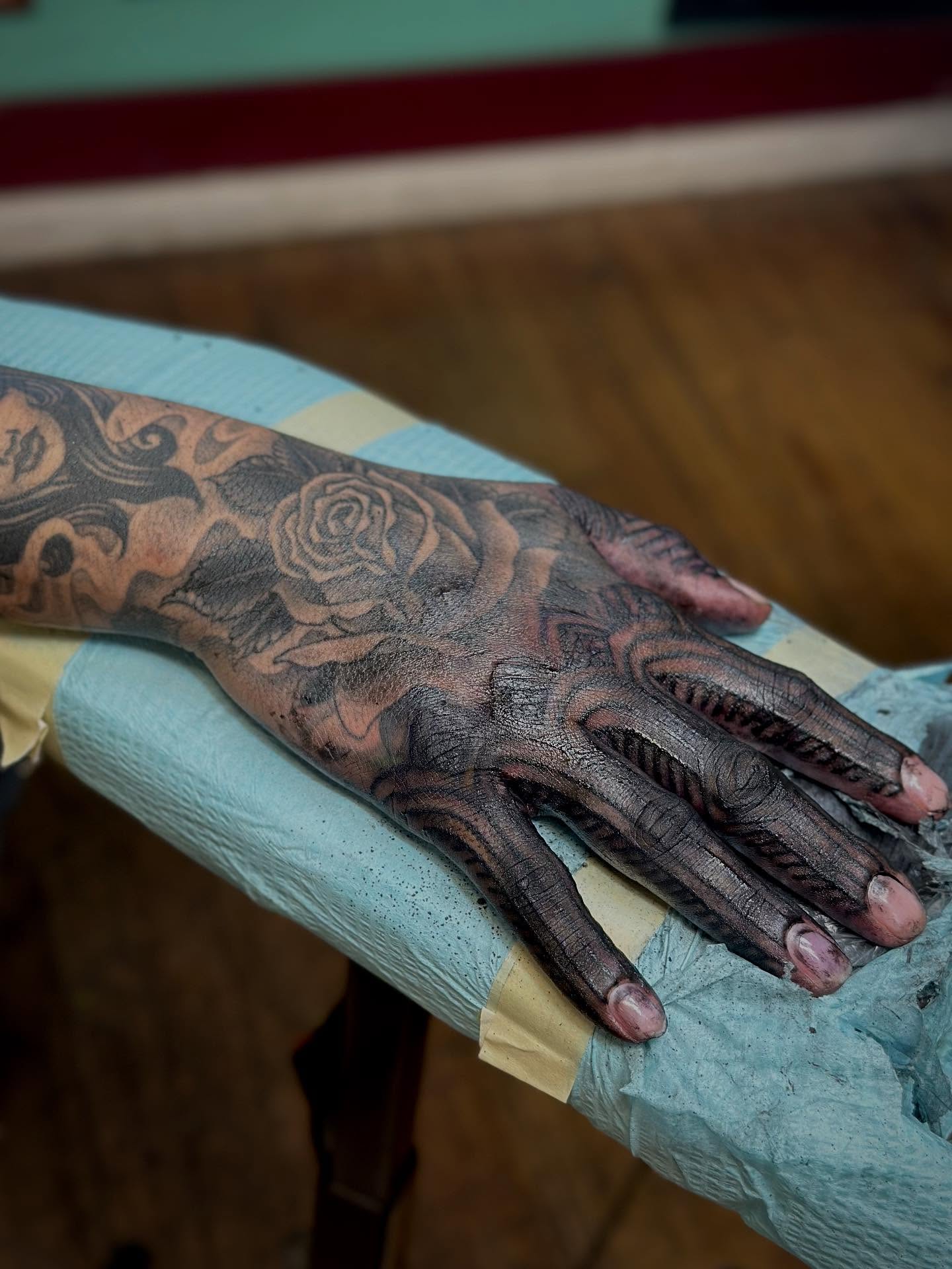 Floral design realism tattoo on the hand by Haley McMahon