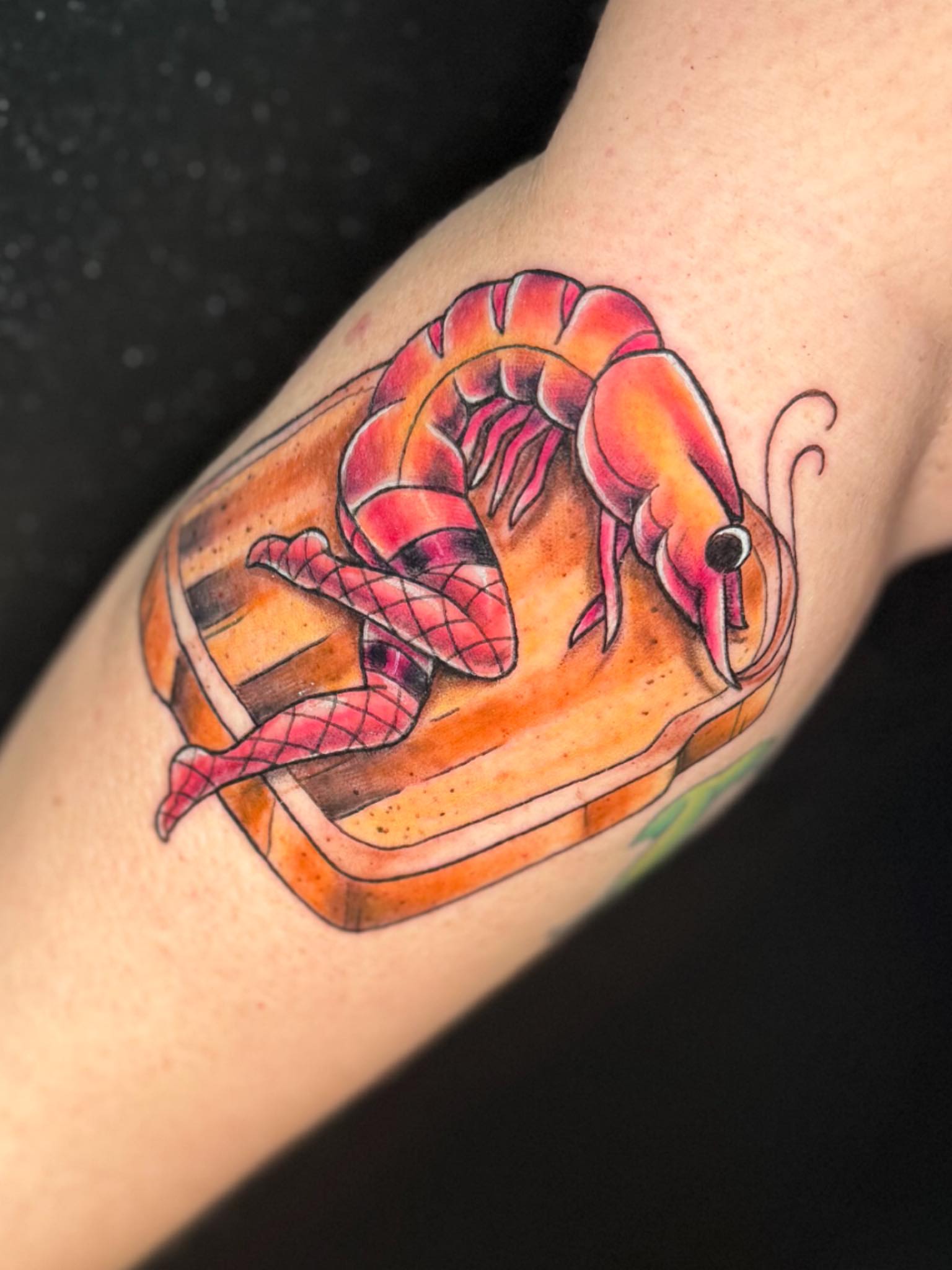 Shrimp in basket American traditional tattoo on the forearm by Breanna B