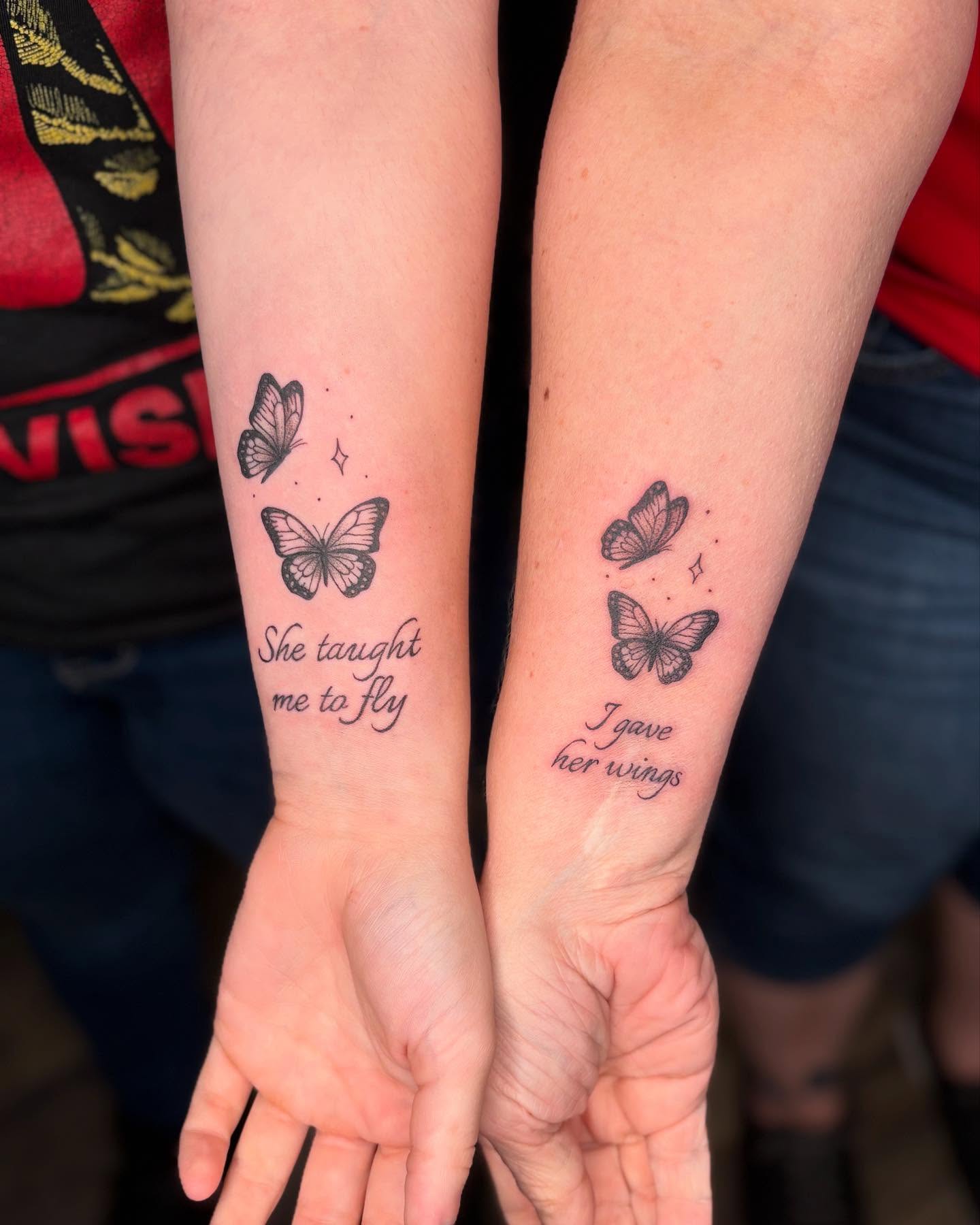 Butterfly and quote black and grey tattoo on the forearm by Tessa Simmons - Tattoo Artist