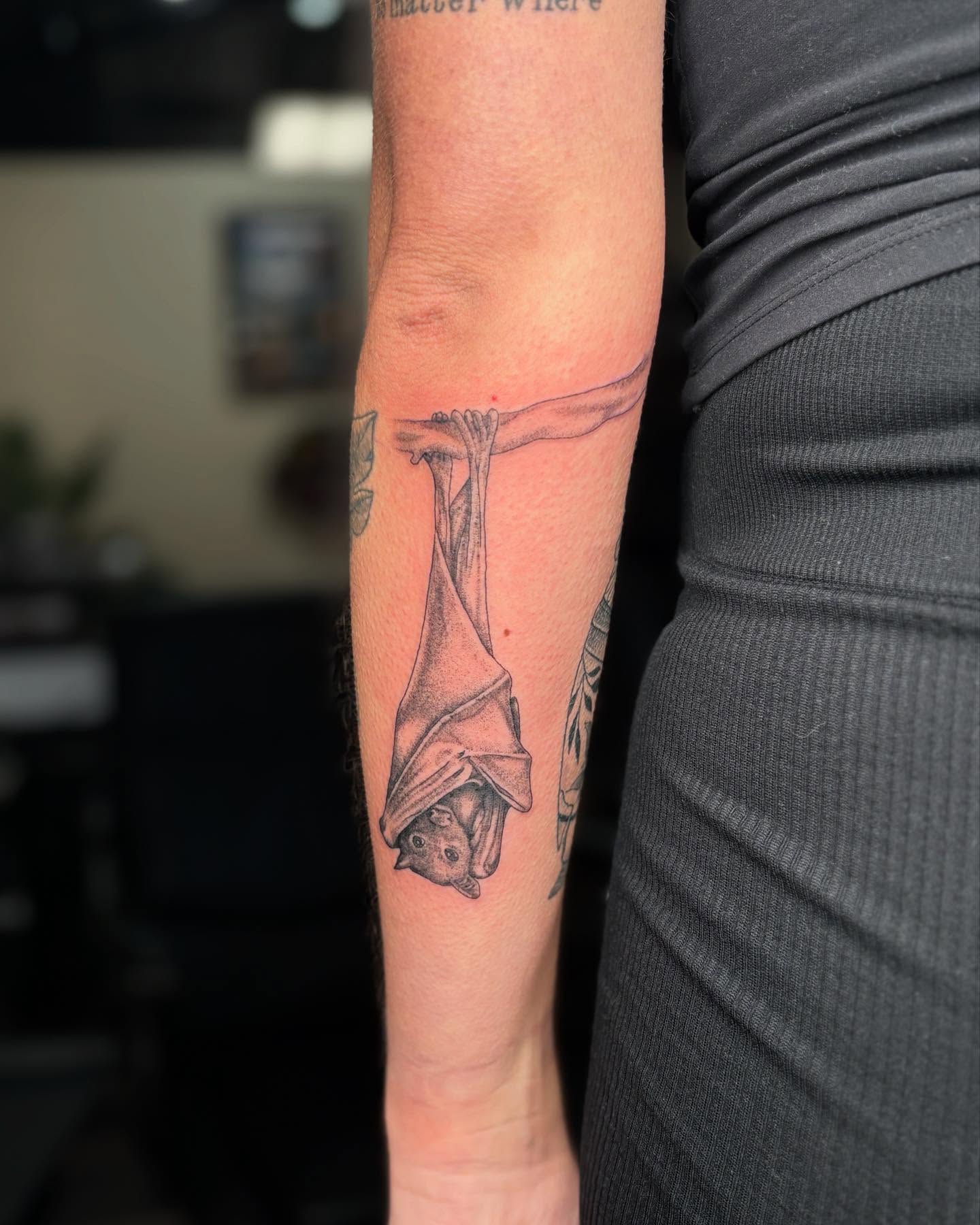 Bat black and grey tattoo on the forearm by Tessa Simmons - Tattoo Artist