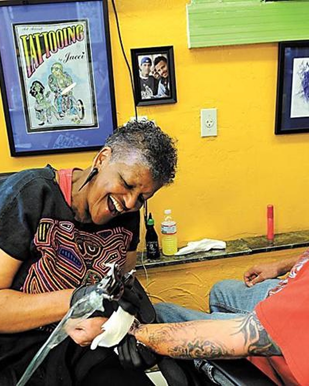 Bird American traditional tattoo on the upper arm by Jacci Gresham