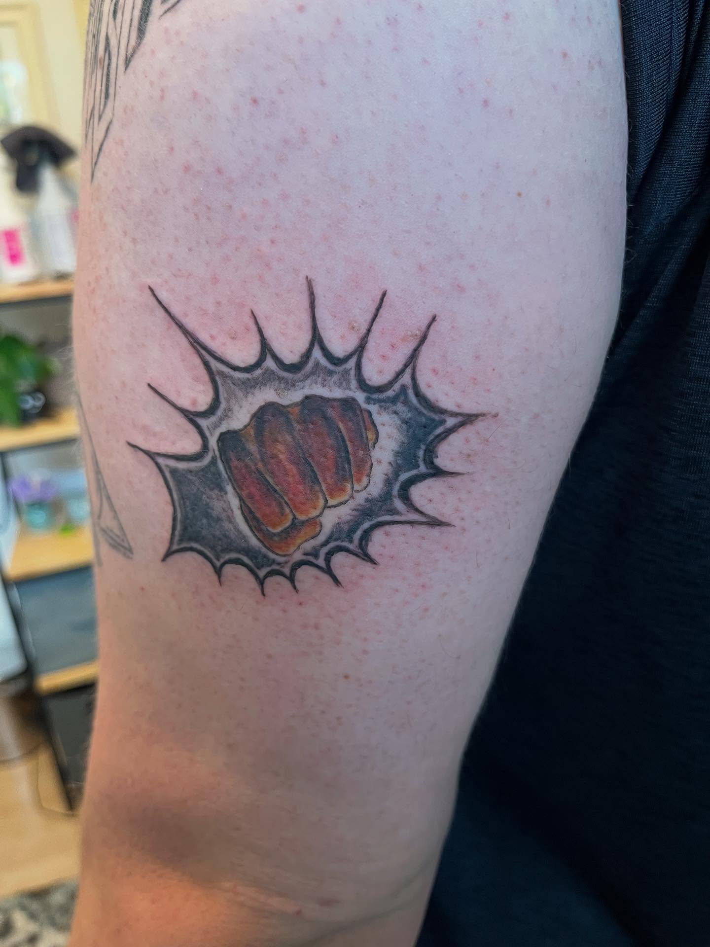 Fist American traditional tattoo on the forearm by Val Maughan