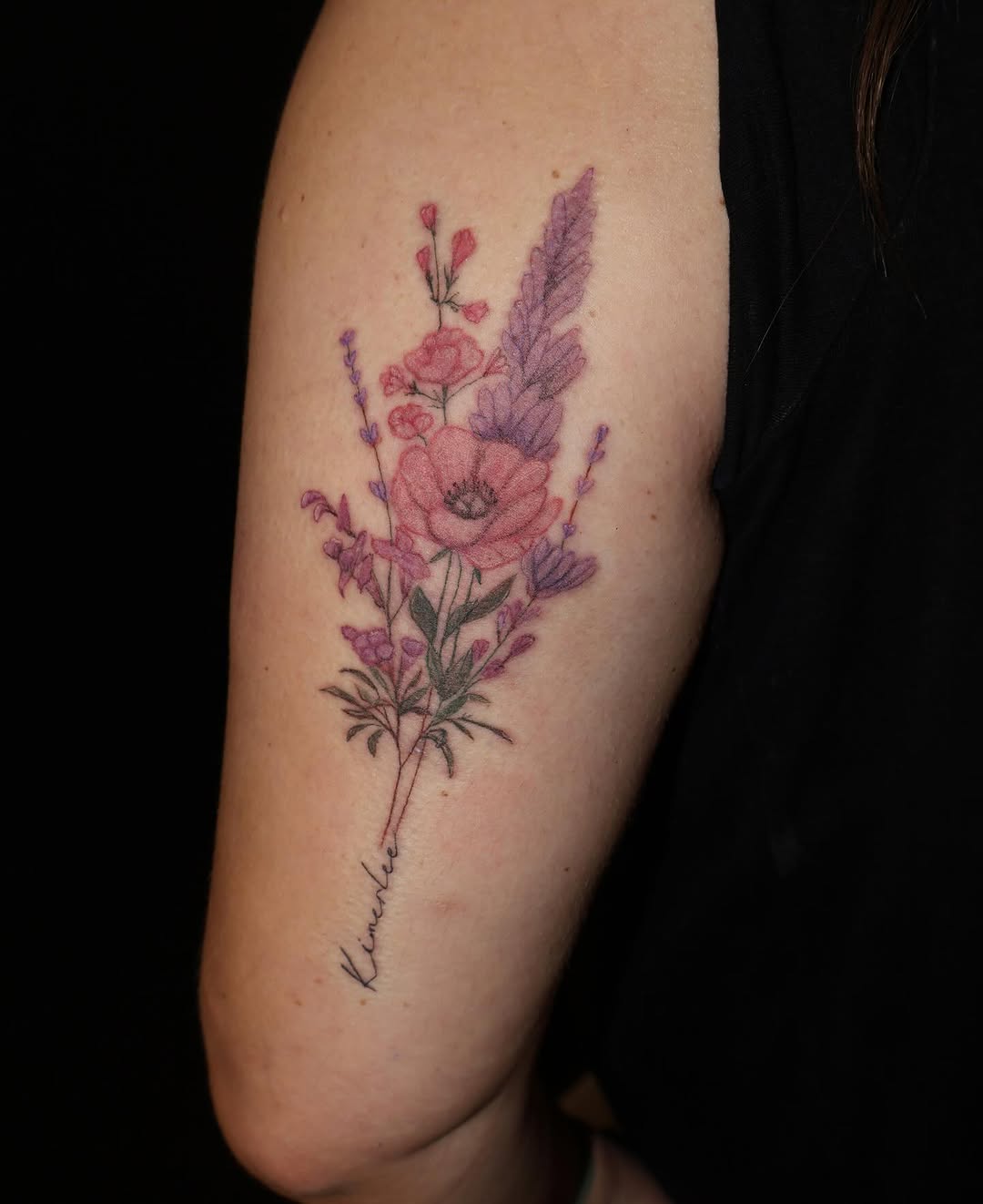 Floral bouquet with script lettering watercolor tattoo on the forearm by TolzinInk, Brookings, South Dakota