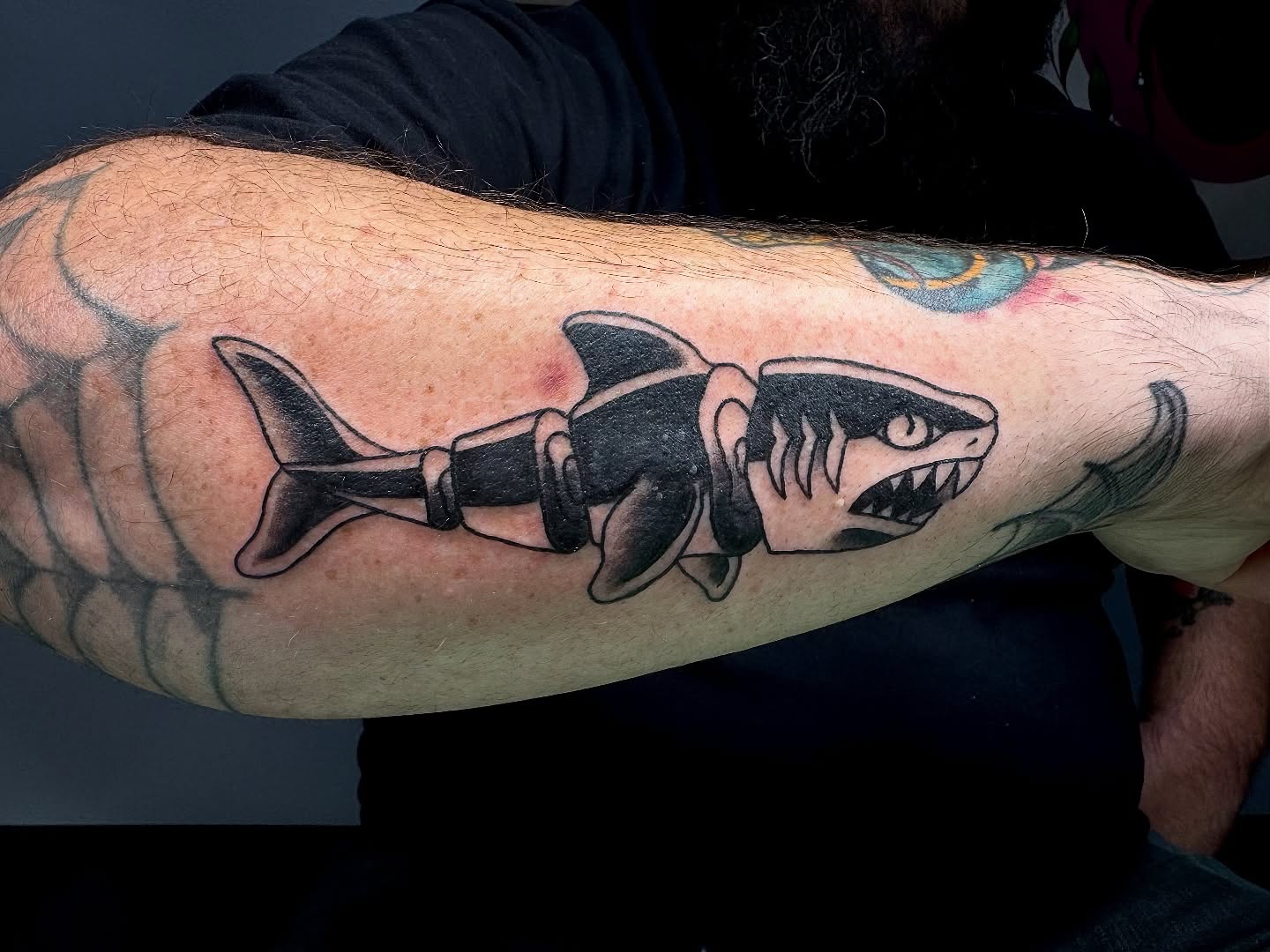 Shark black and grey tattoo on the forearm by Minxxy Tattoos