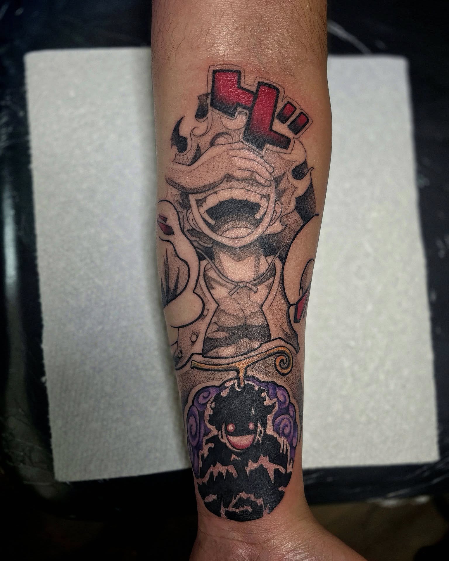 Anime character anime tattoo on the forearm by Sai Machain