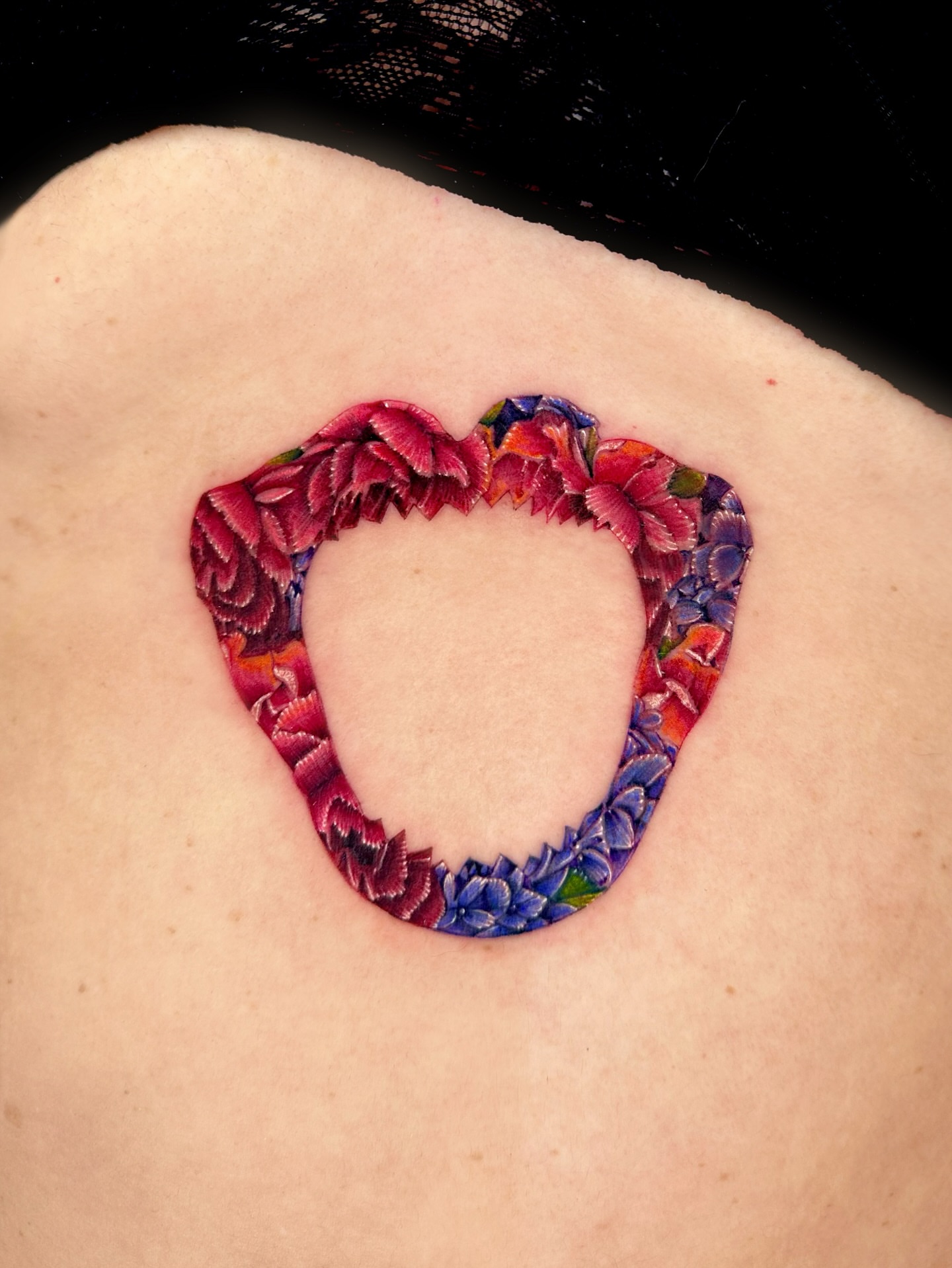 Floral heart new school tattoo on the shoulder by Claire
