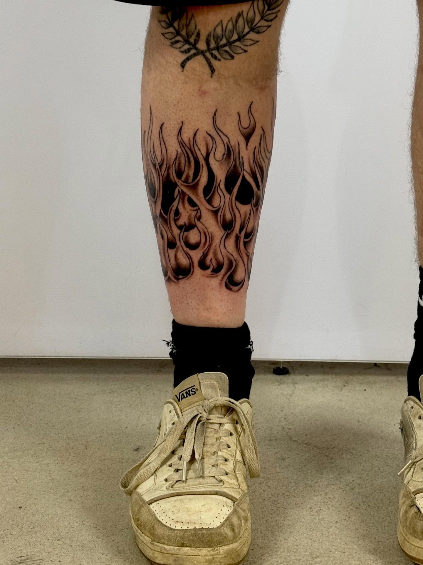 Flames black and grey tattoo on the calf by Paul Calhoun Tattoos, Englewood, Ohio
