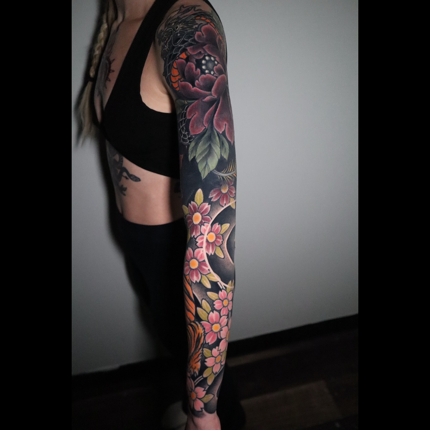 Floral sleeve japanese irezumi tattoo on the upper arm by Lauren Howard Tattoos