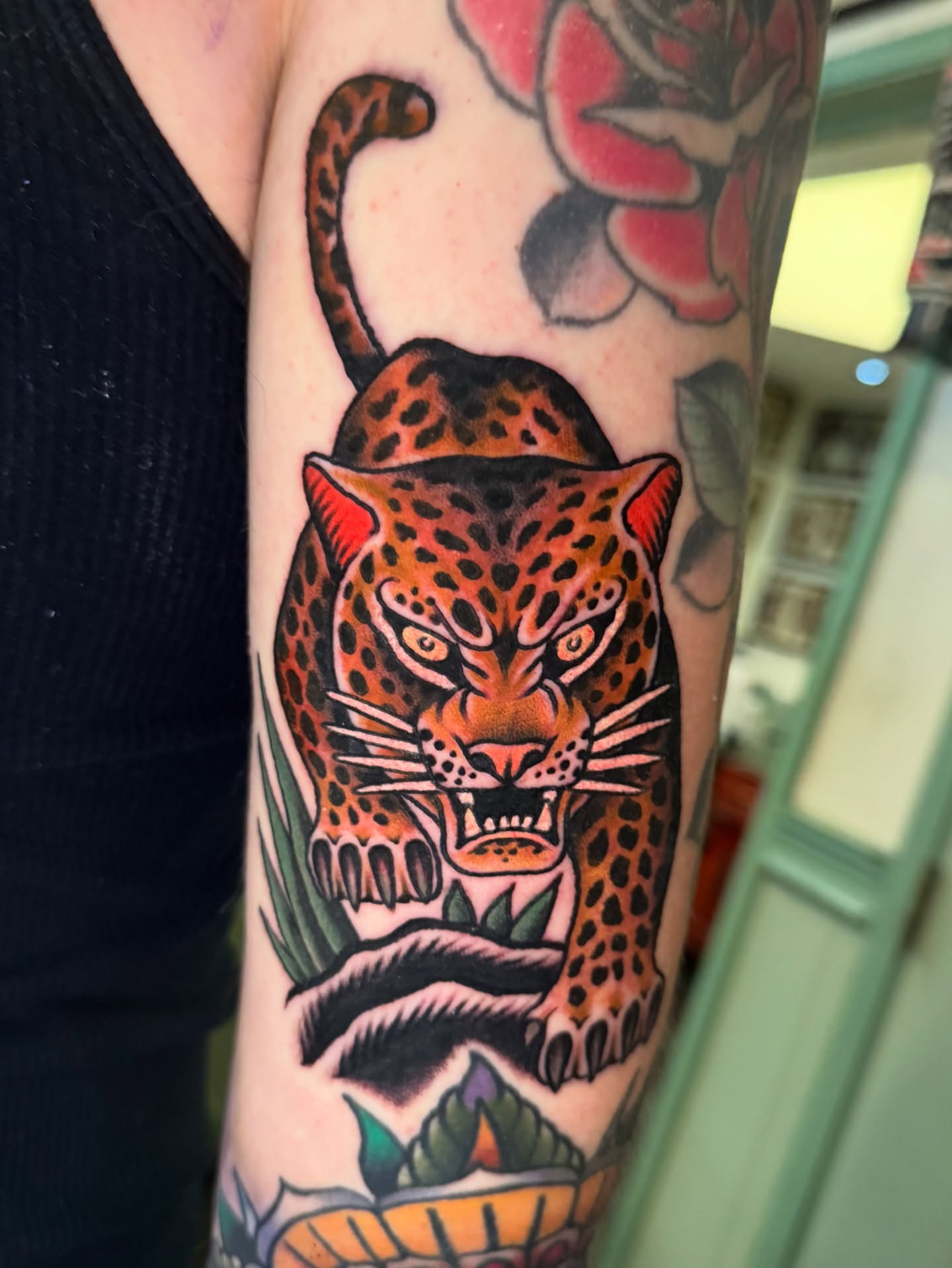 Leopard American traditional tattoo on the forearm by Pavel