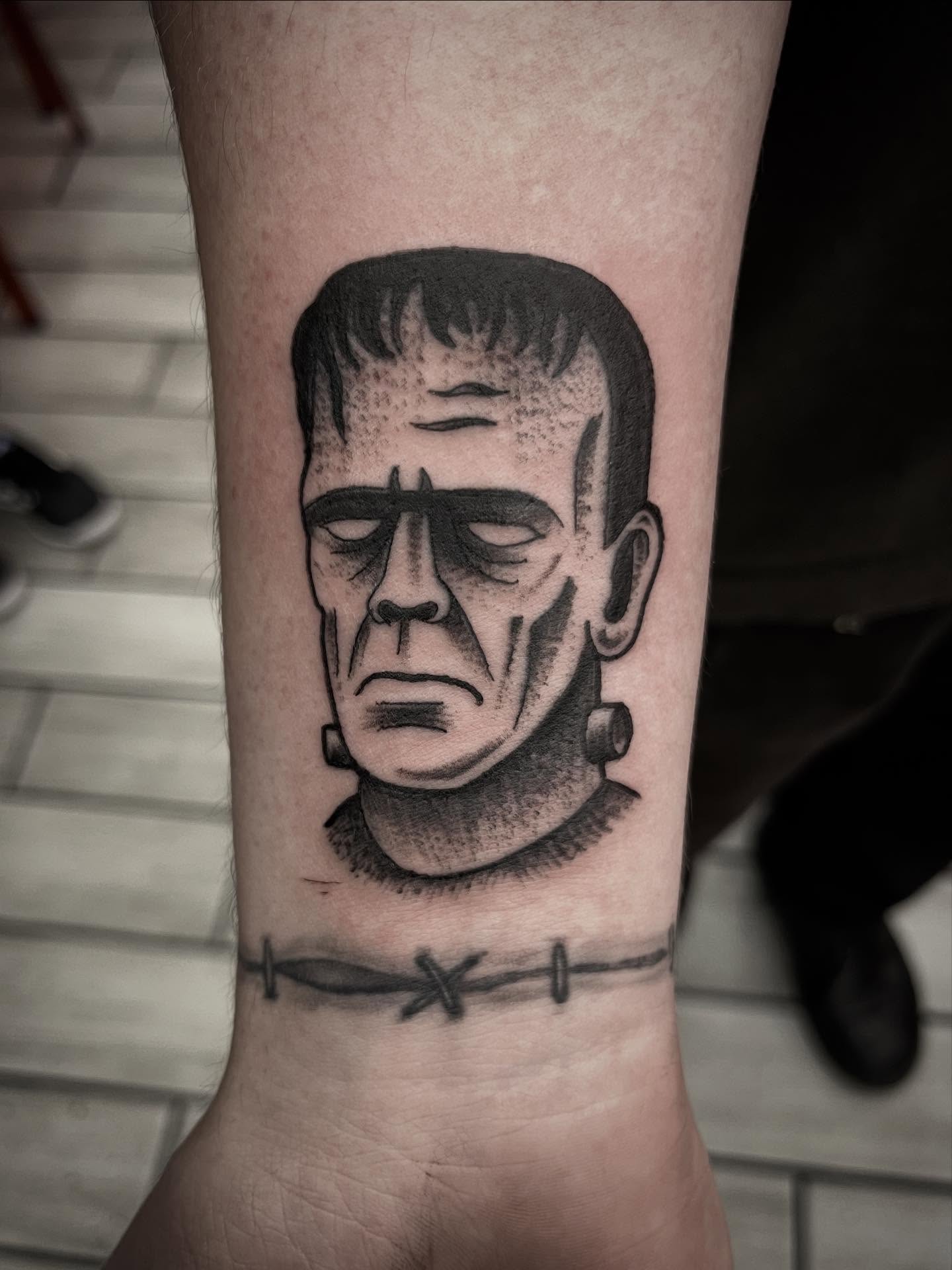 Frankenstein realism tattoo on the forearm by Sean Gallagher
