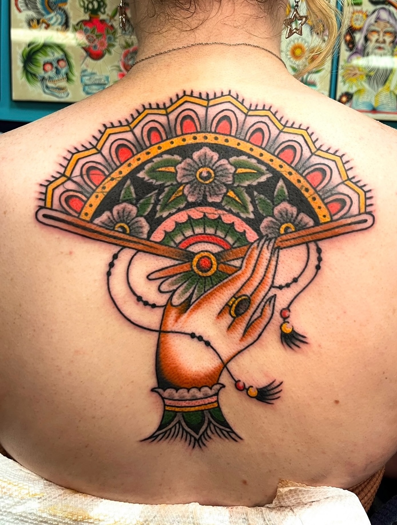 Fan and dragon American traditional tattoo on the back by Macy Bird
