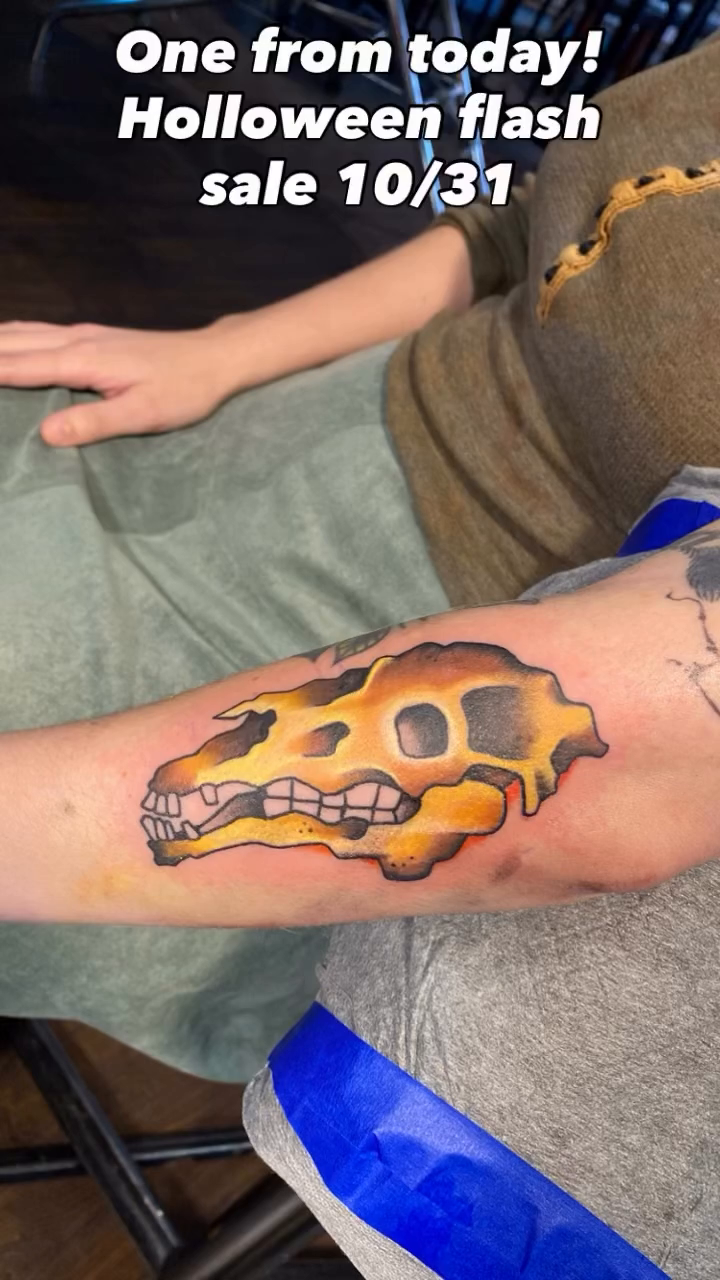 Skull with flames tattoo on the forearm by jim collins, Dayton, Ohio