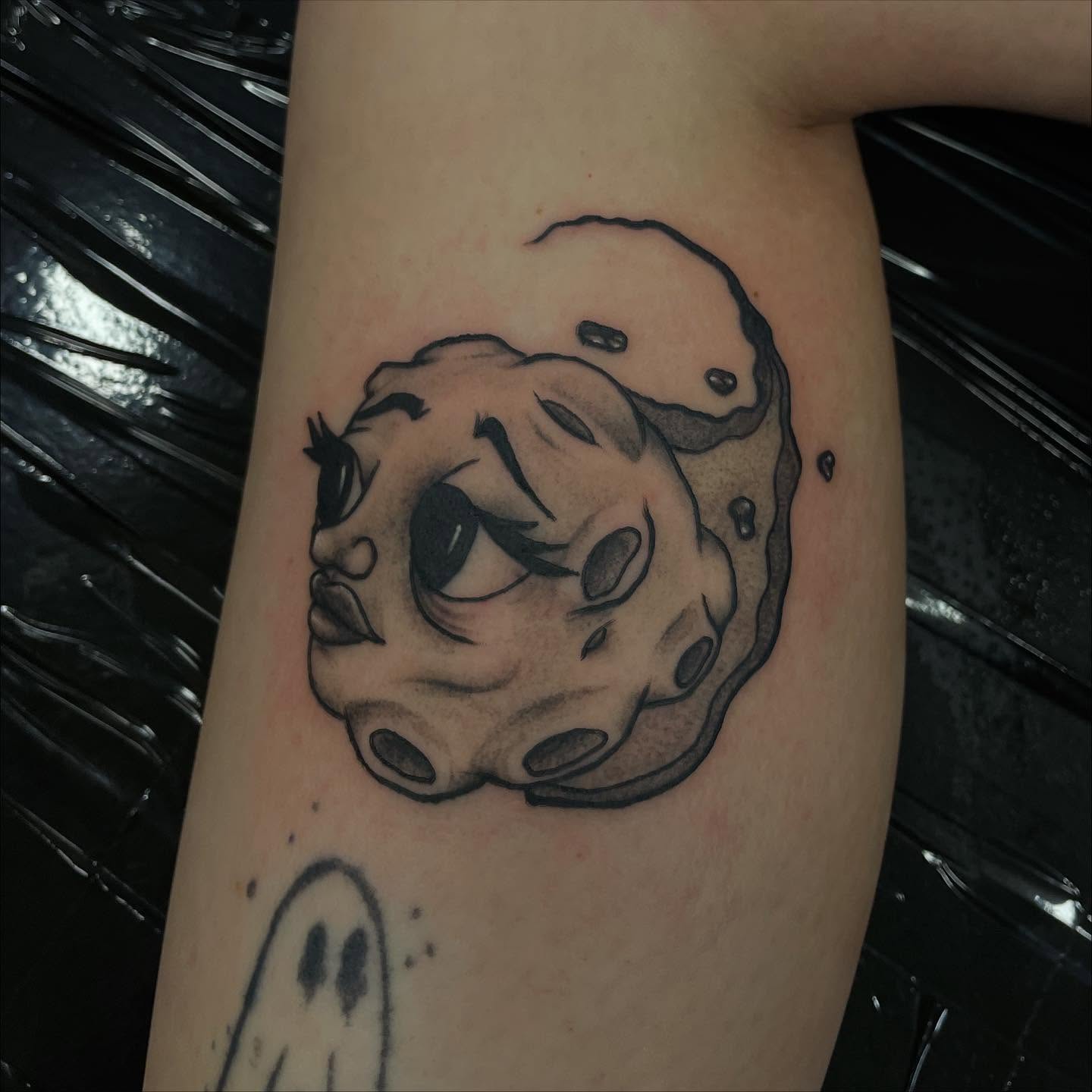 Moon with eyes black and grey tattoo on the forearm by Jenna Fraticelli, Monroeville, Pennsylvania