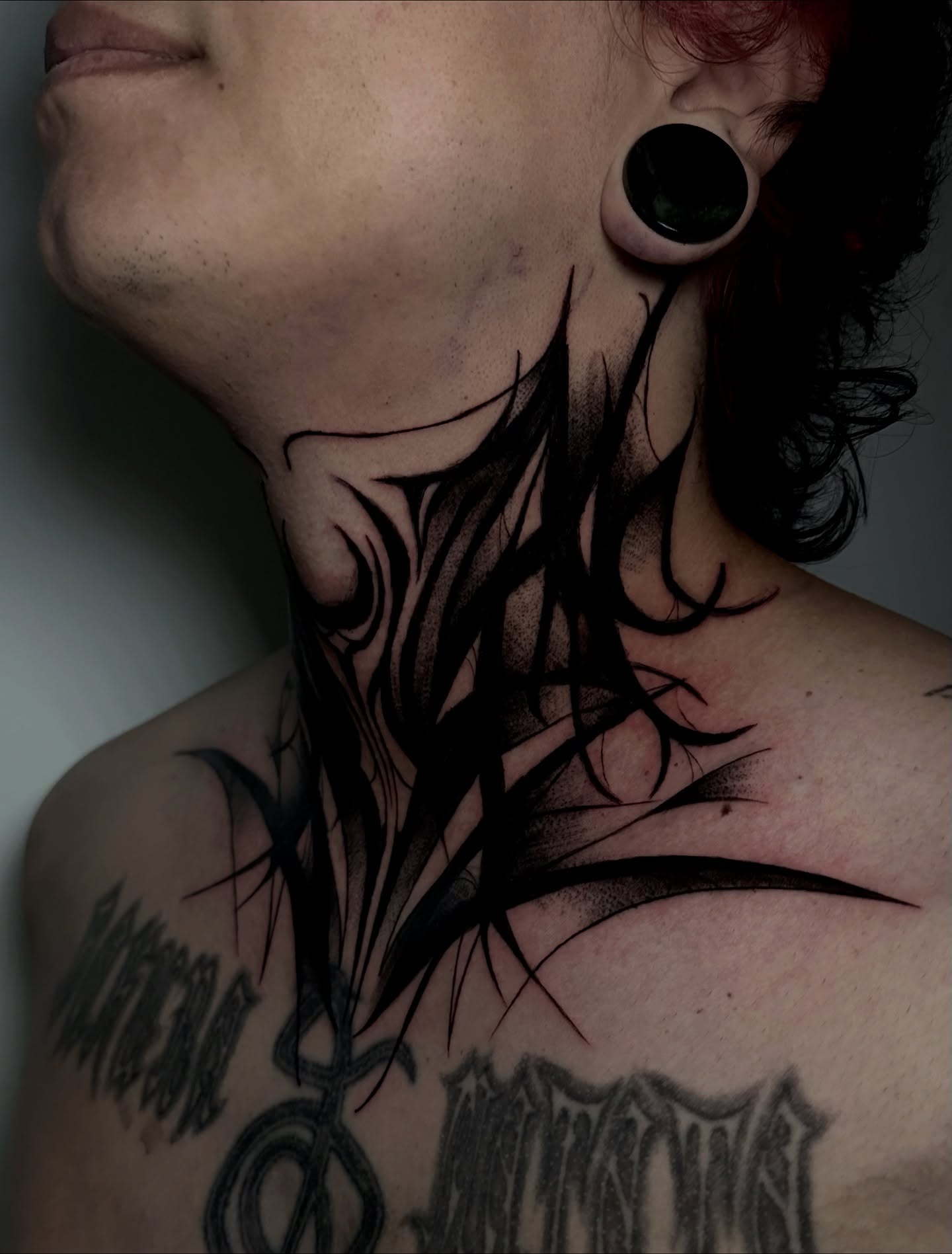 Abstract design black and grey tattoo on the neck by Crystal, Las Vegas, Nevada
