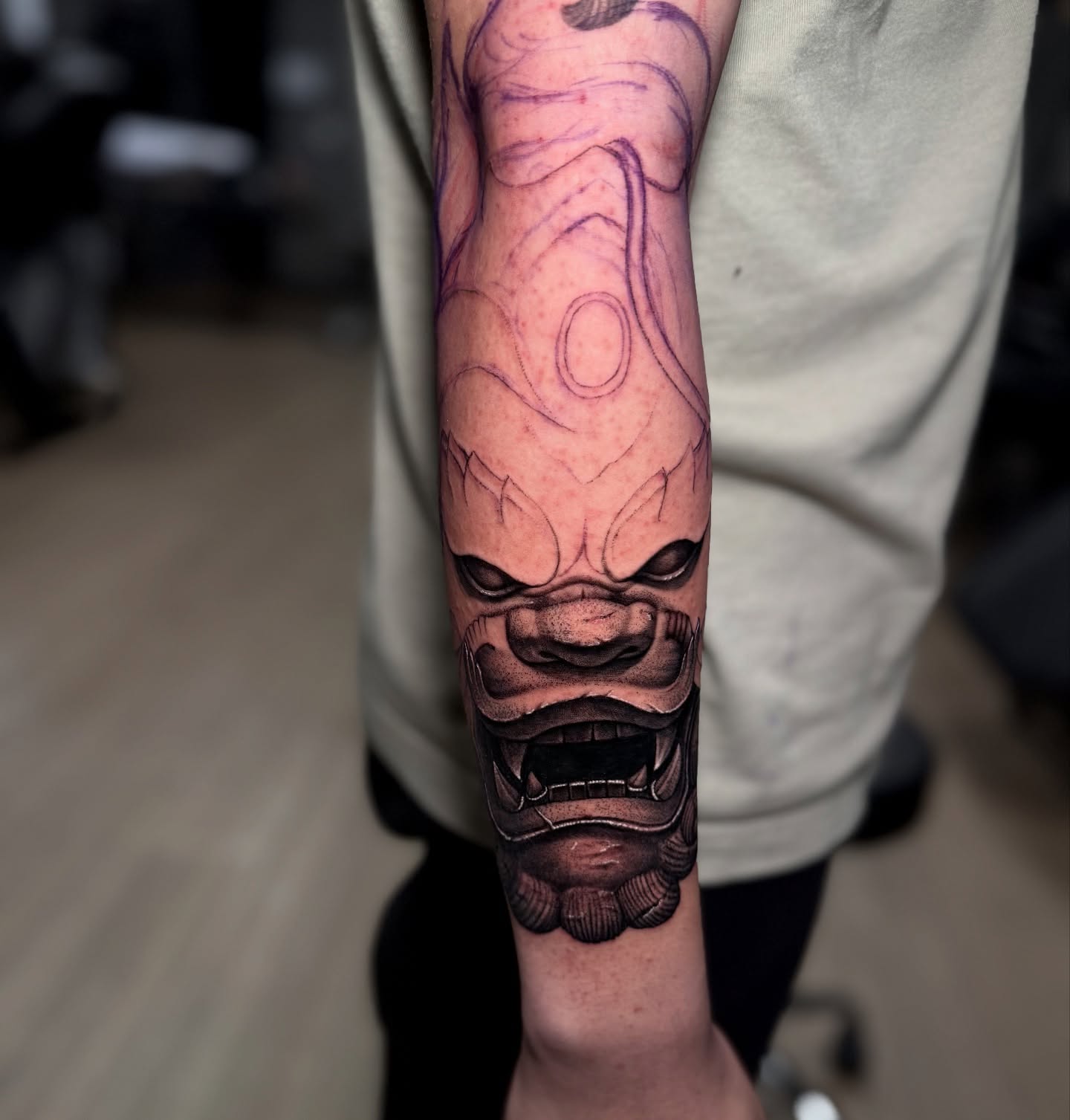 Demon mask dark realism tattoo on the forearm by Anh Nguyen