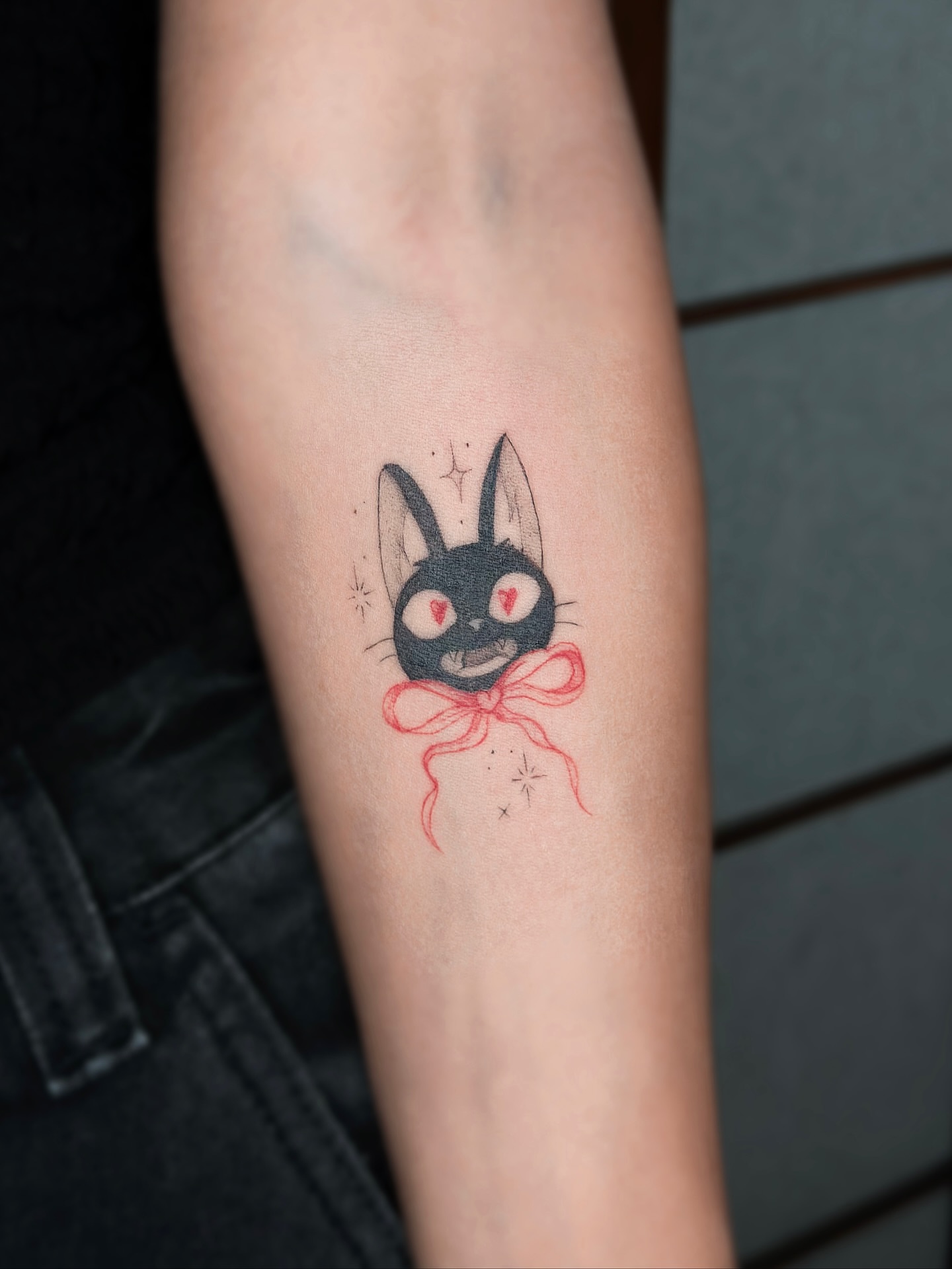 Black rabbit dotwork tattoo on the forearm by Mila, Riga, Latvia