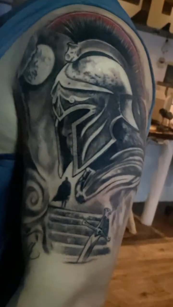 Spartan helmet realism tattoo by Breyner, Cambridge, Massachusetts