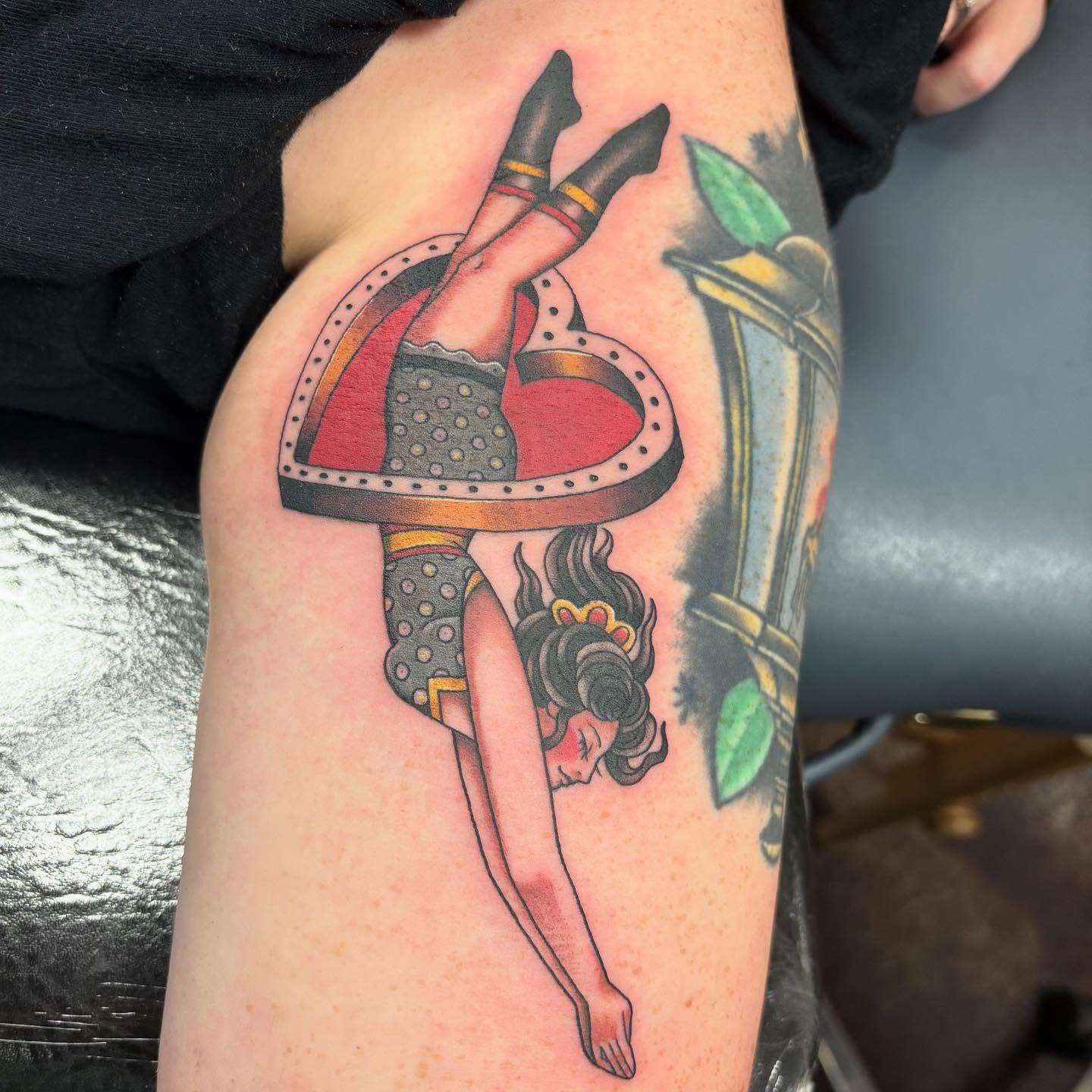 Woman in heart American traditional tattoo on the thigh by Jakob Ristau, Kansas City, Missouri