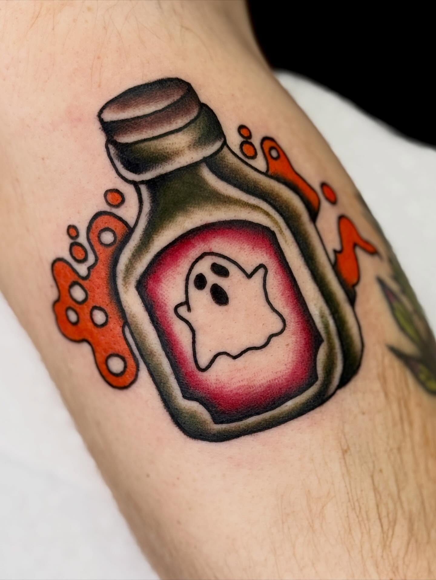 Ghost in bottle American traditional tattoo on the forearm by Meg Nefcy, Milford, Michigan