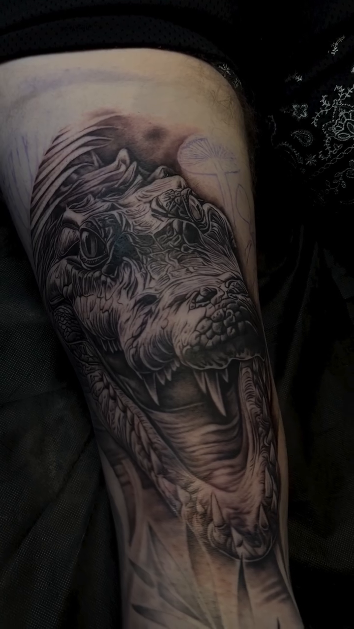 Alligator head realism tattoo by Ethan Hubbard