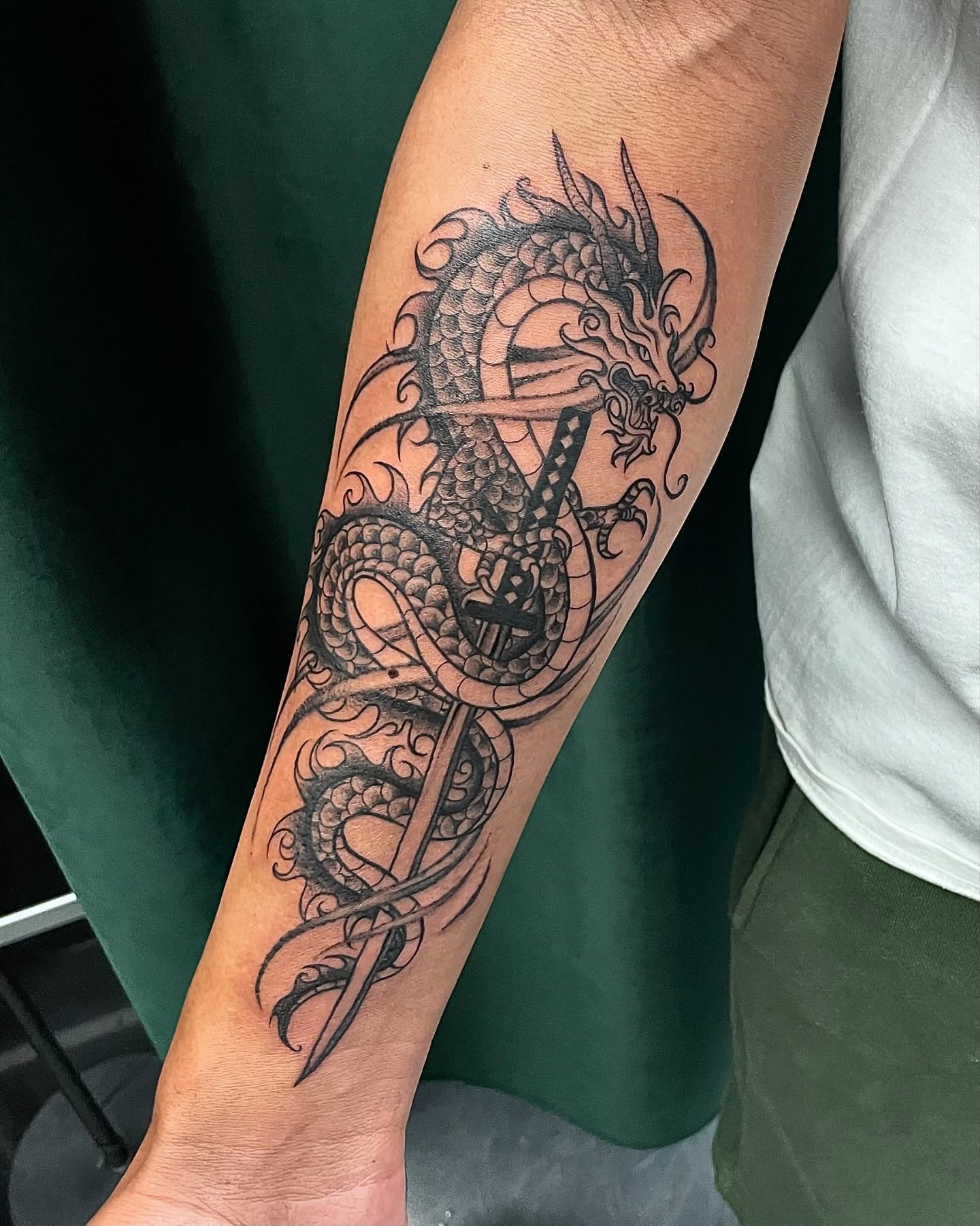 Dragon black and grey tattoo on the forearm by 𝕲𝖗𝖆𝖈𝖊 🥀 ᴛᴀᴛᴛᴏᴏ