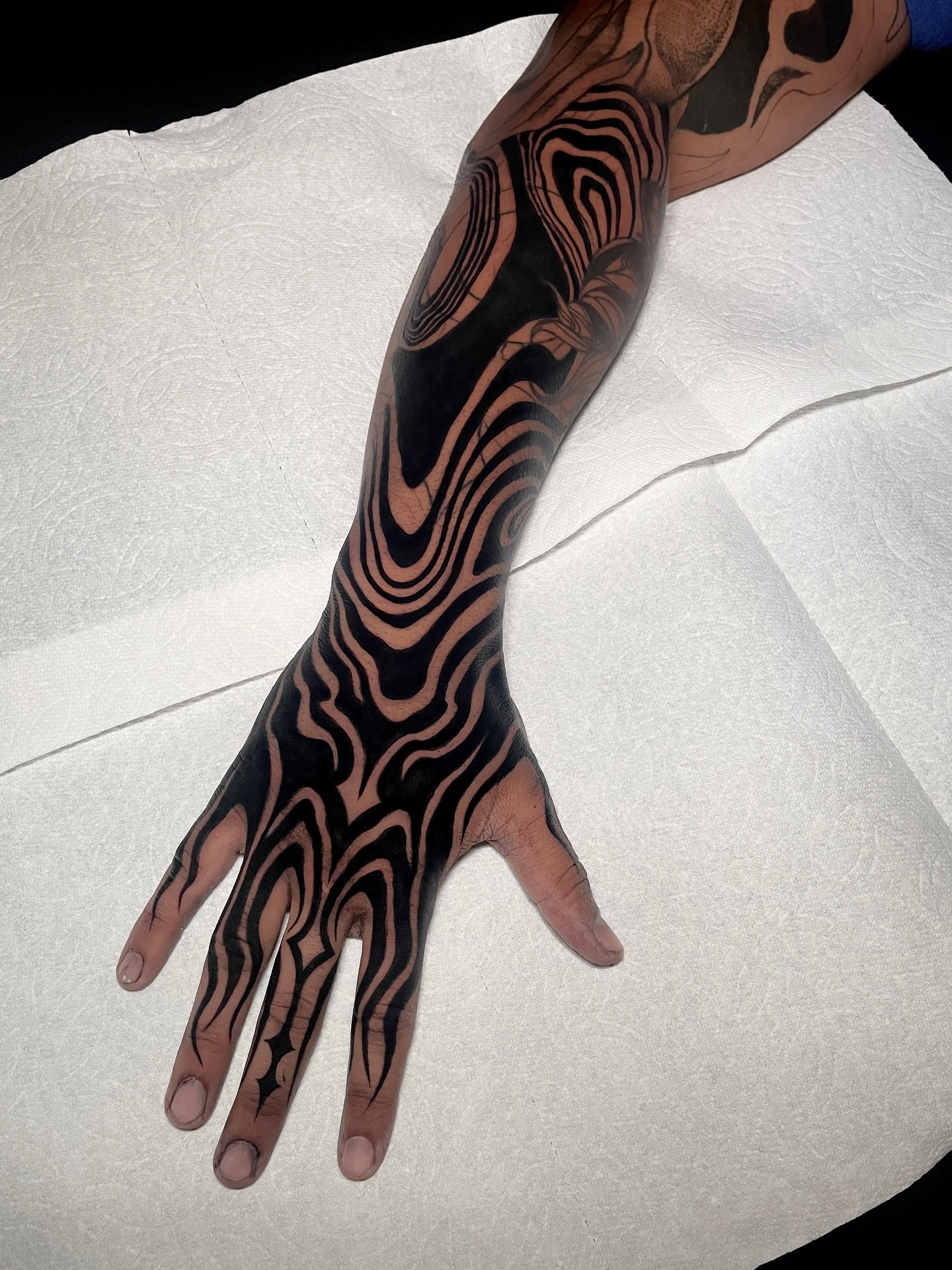 Wave pattern tribal tattoo on the hand by LA tattoo