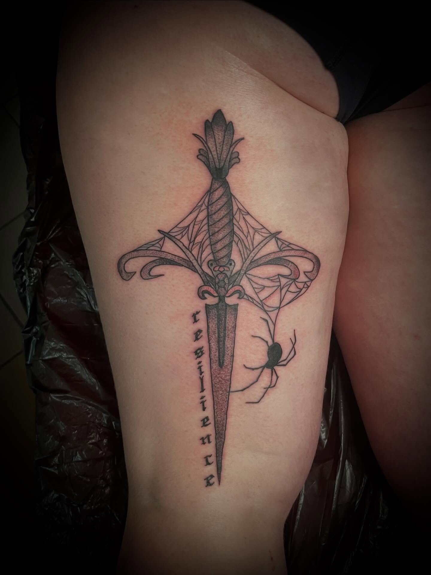Sword and spider geometric tattoo on the thigh by lu ๐