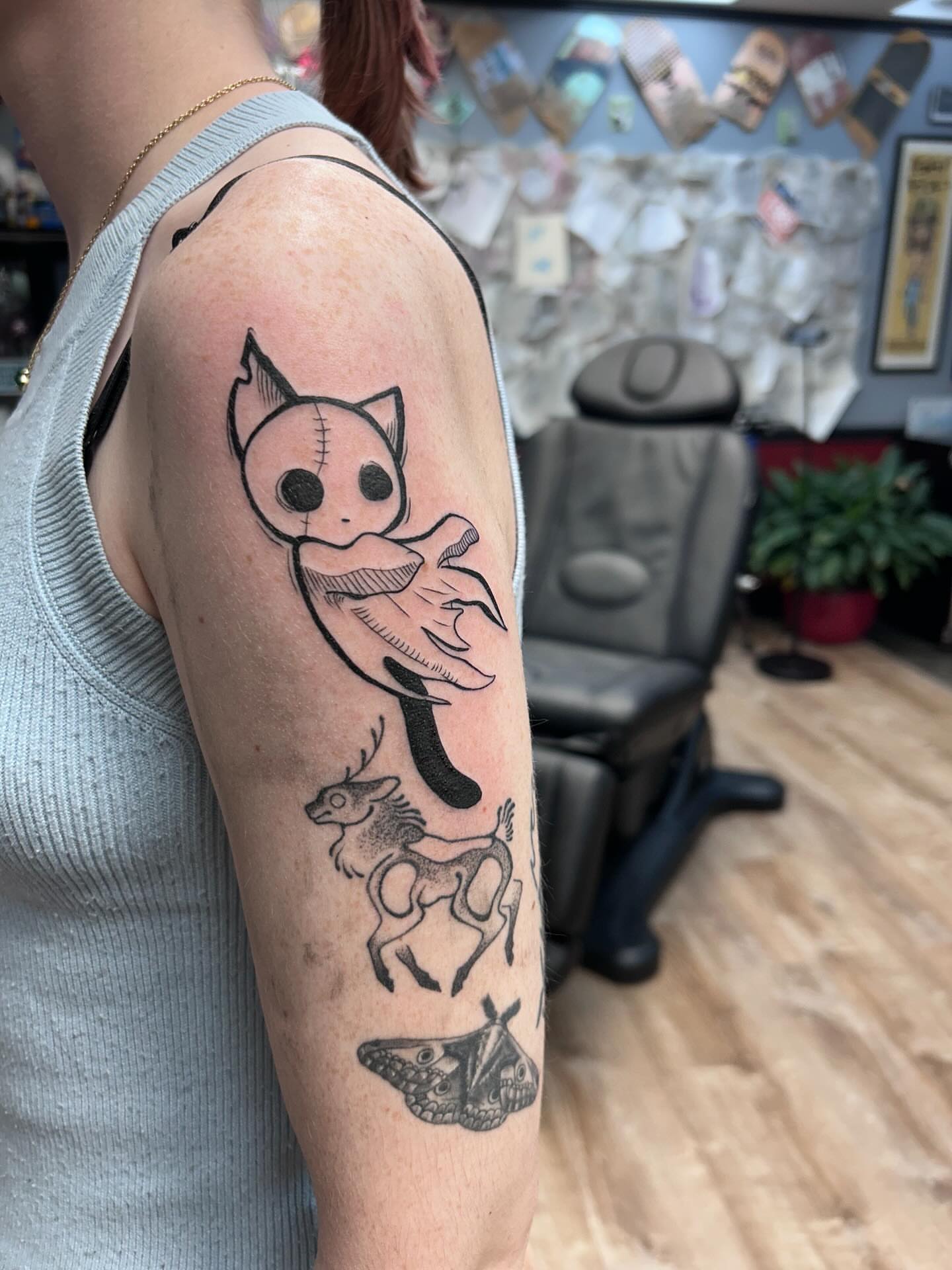Cat and deer black and grey tattoo on the forearm by Ricardo (RJ)