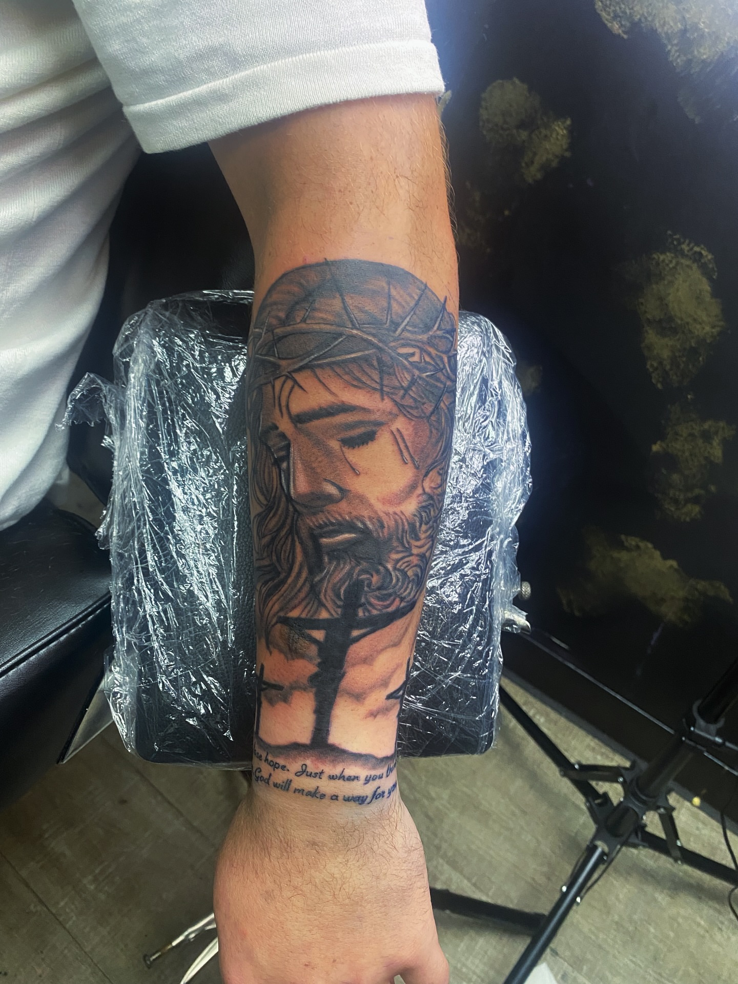 Jesus Christ realism tattoo on the forearm by Rico Rosario