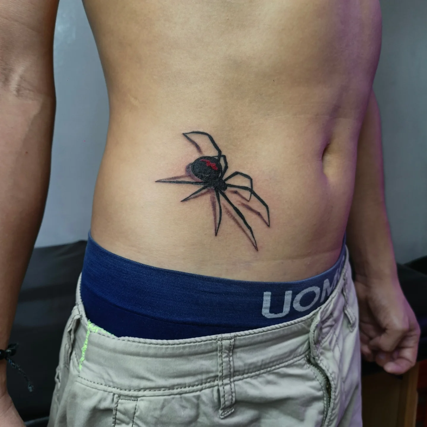 Spider realism tattoo on the ribs by Alexander Tattooink