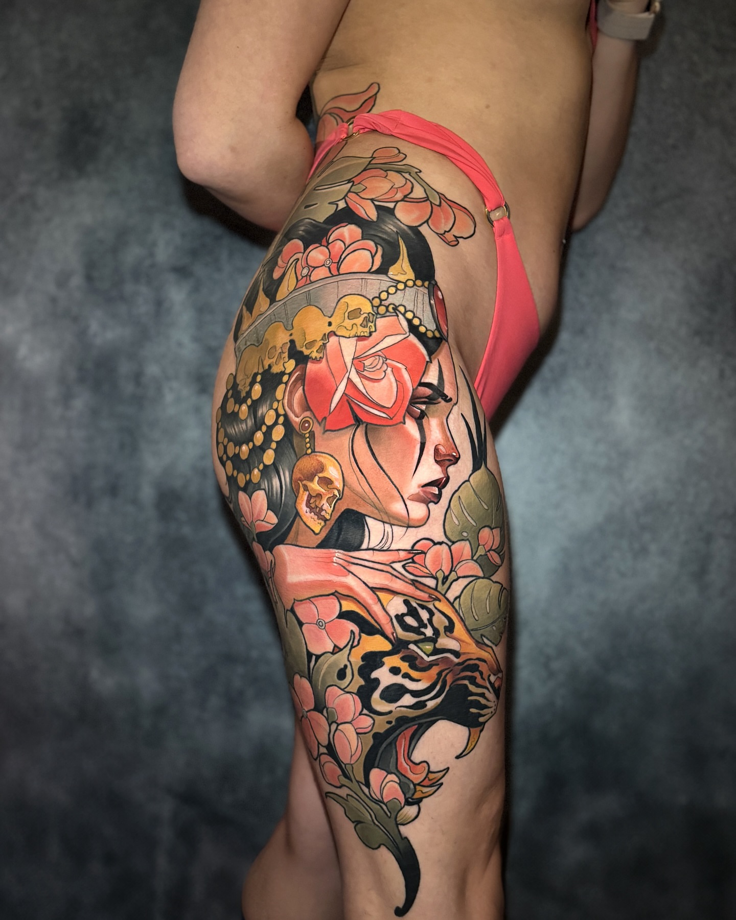Woman with flowers and skull American traditional tattoo on the thigh by Matt - Neotrad Tattoos, New York, New York