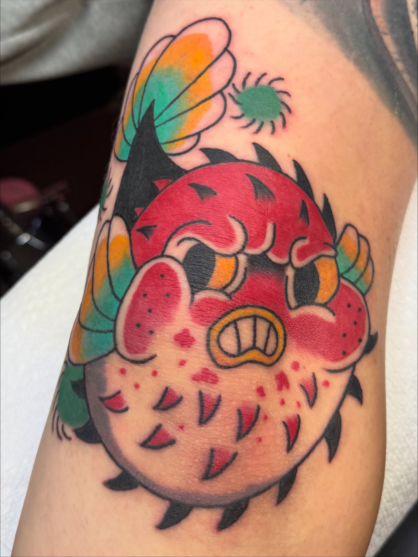 Strawberry monster American traditional tattoo on the forearm by Kelsey Turnis