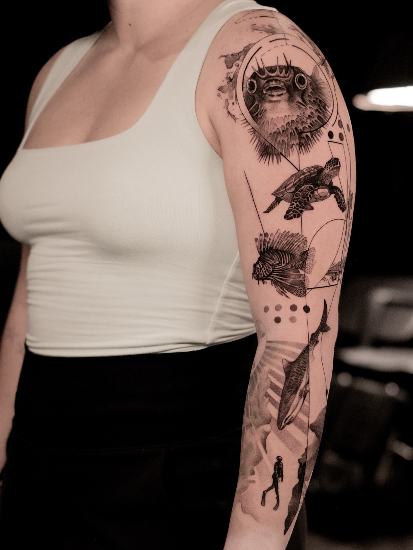 Underwater creatures realism tattoo on the upper arm by Mark D, Los Angeles, California