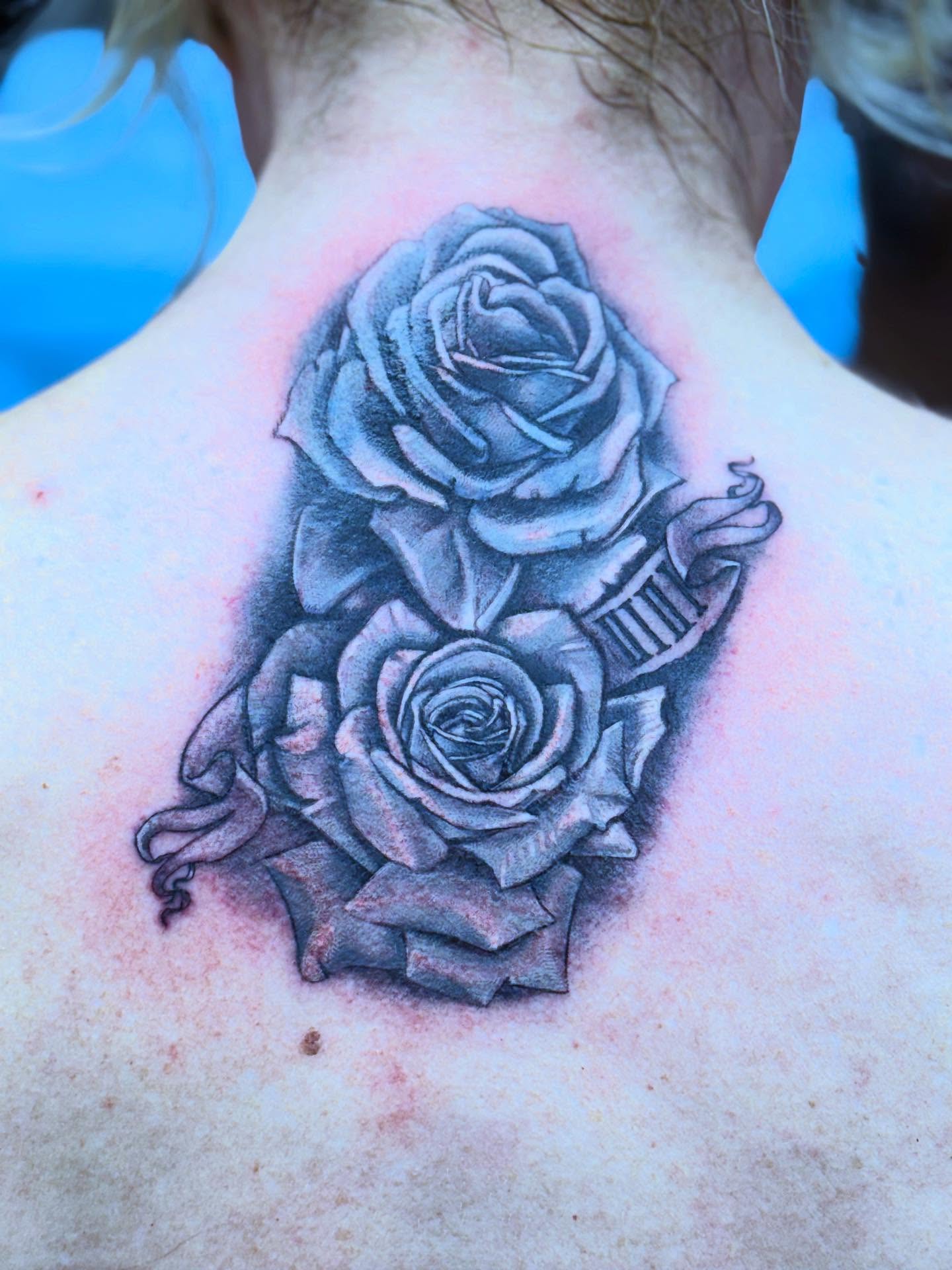 Roses black and grey tattoo on the back by Aaron Hassler, Nashville, Tennessee