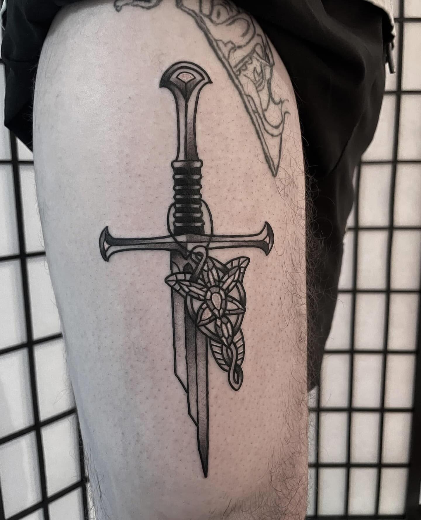 Sword and knot black and grey tattoo on the thigh by ๐๐ช๐๐ซ๐ก๐ ๐๐ฏ๐ถ๐ฉ๐
