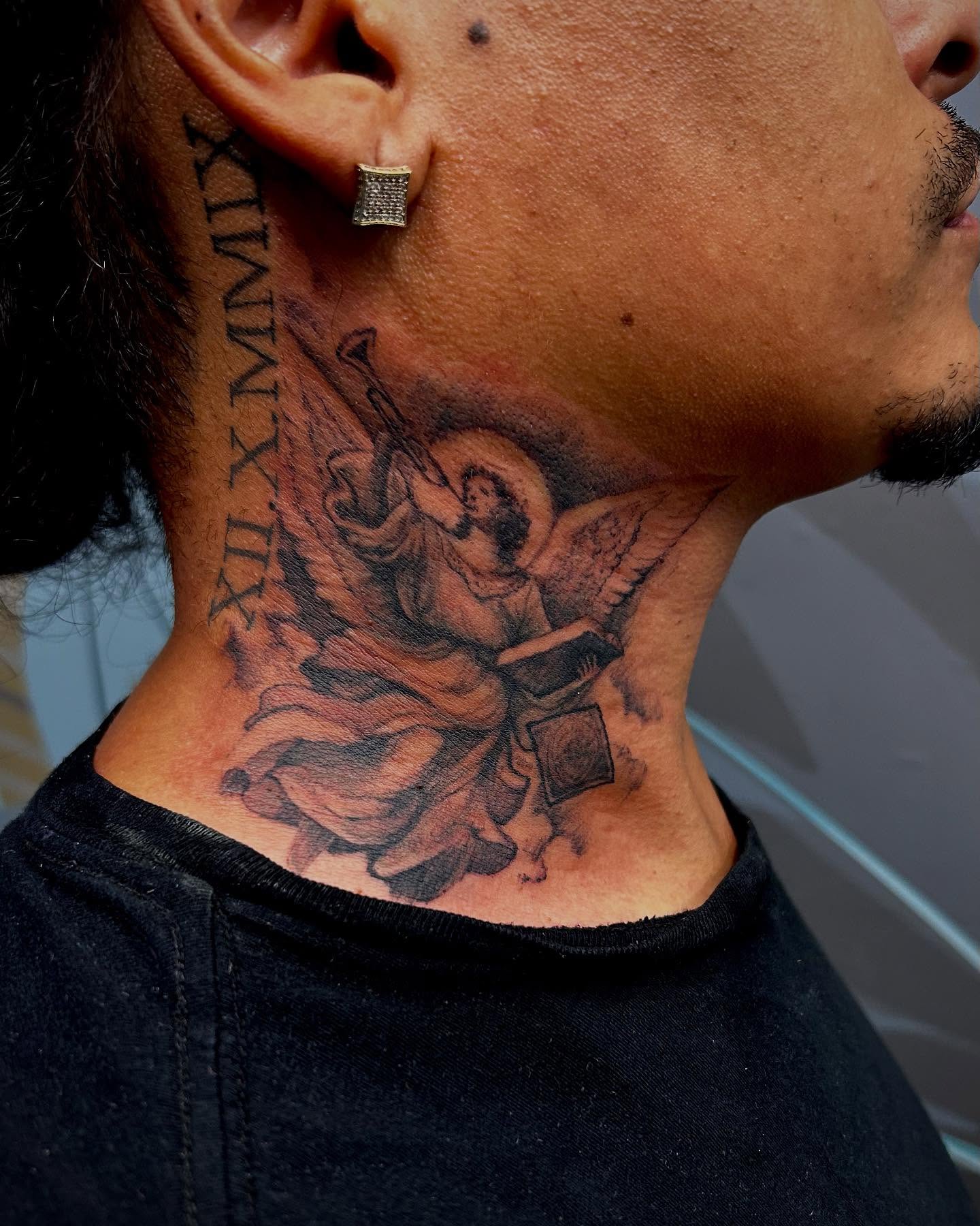 Angel with violin realism tattoo on the neck by Jon Byrd