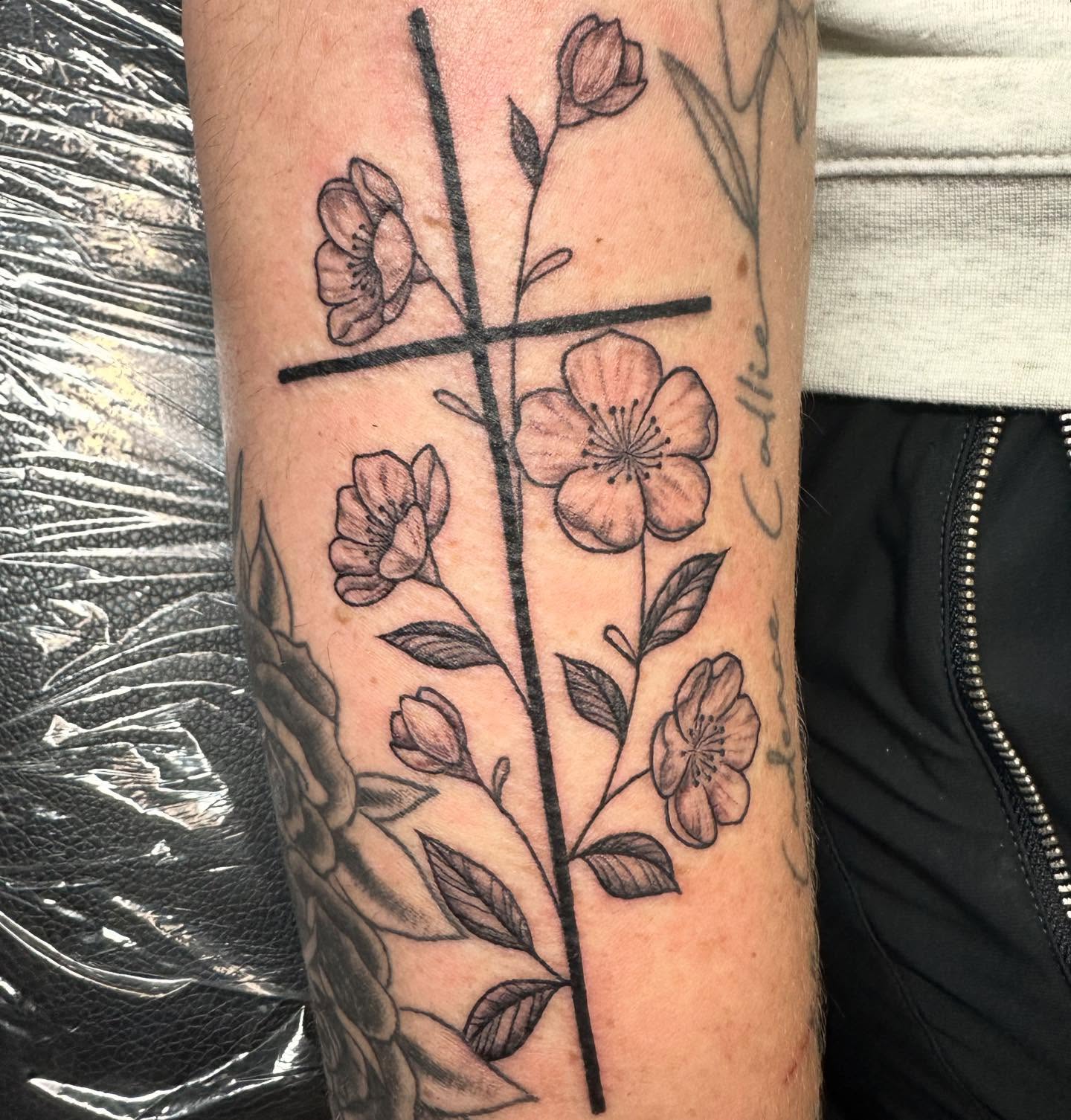 Cherry blossoms black and grey tattoo on the forearm by Sarah Nash