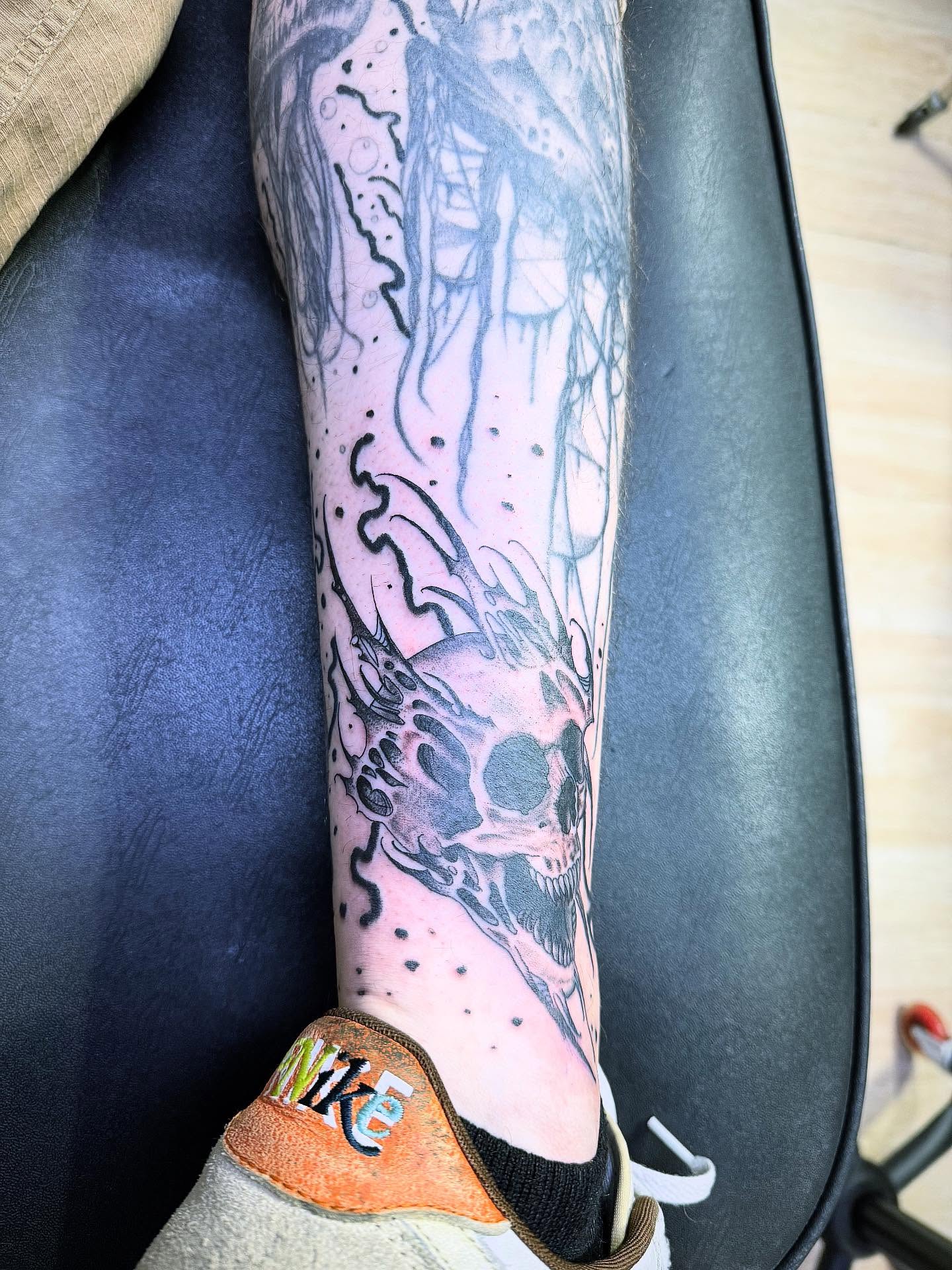 Skull dotwork tattoo on the calf by C. Compa