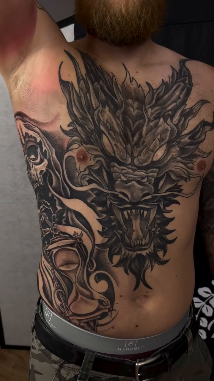Tattoo by @codylambert_tattoos — dark_realism, black_and_grey